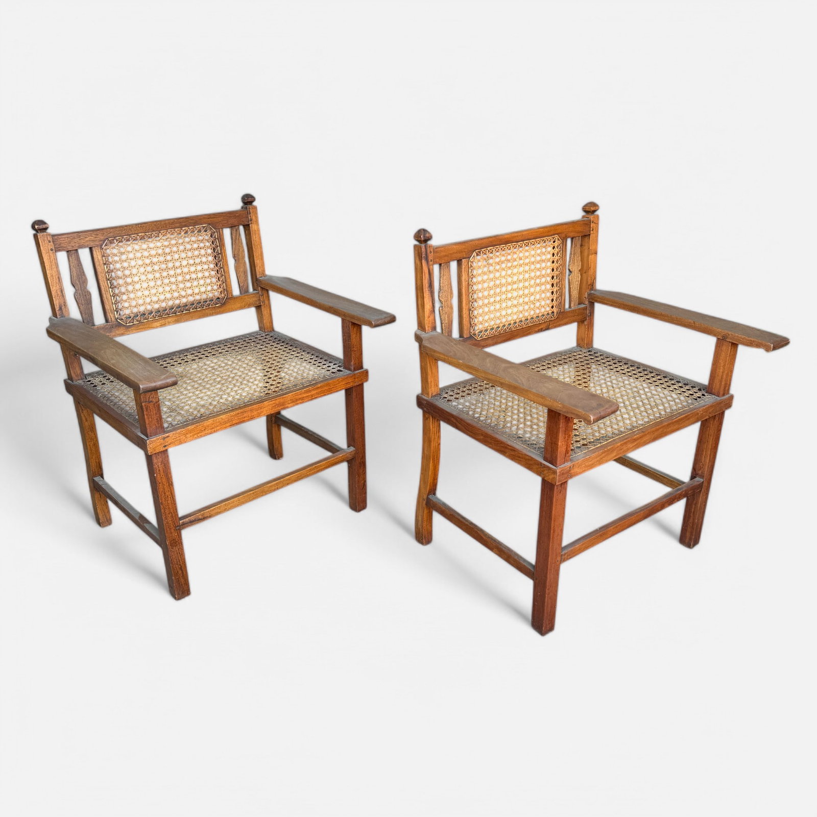 Pair Antique 19thC English Colonial Carved Wood and Cane Armchairs: Ca. last half 19thc. Good overall with no breaks, holes or repairs. Pair English Colonial Carved Wood Cane Armchairs.