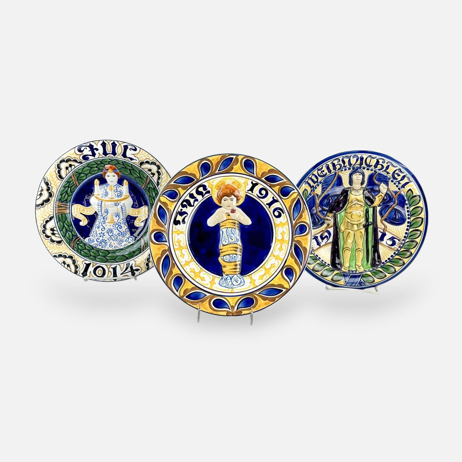 Three Royal Copenhagen Faience Porcelain Christmas Plates 1914, 1915, 1916: Very good, with only minor surface abrasions. Free from any chips, cracks, or repairs.