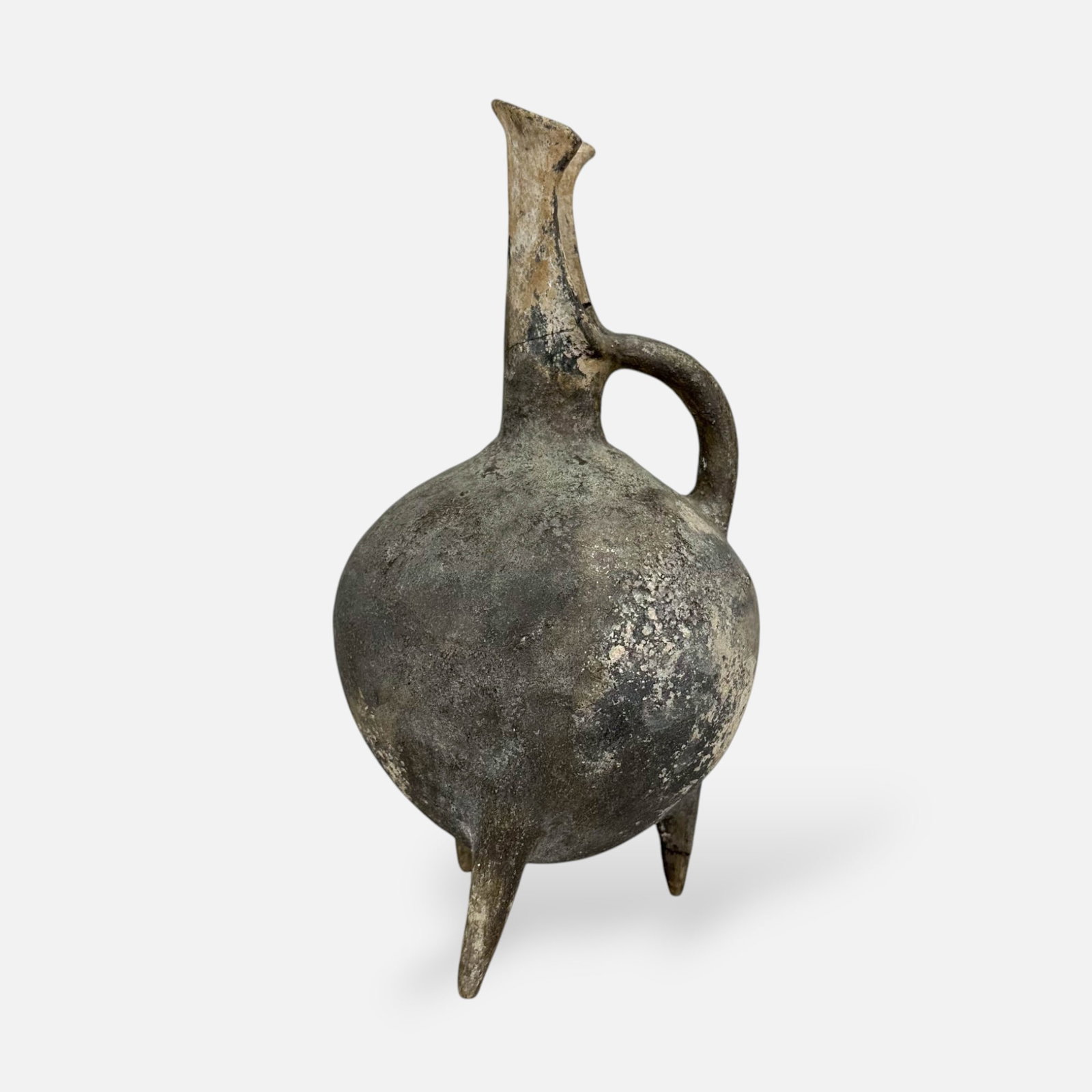 Ancient Anatolian Yortan Black Clay Tripod Pitcher Vessel: Early Bronze Age II, ca. 2700-2400 BCE. Surface wear consistent with age. Repairs to mouth and one leg.
