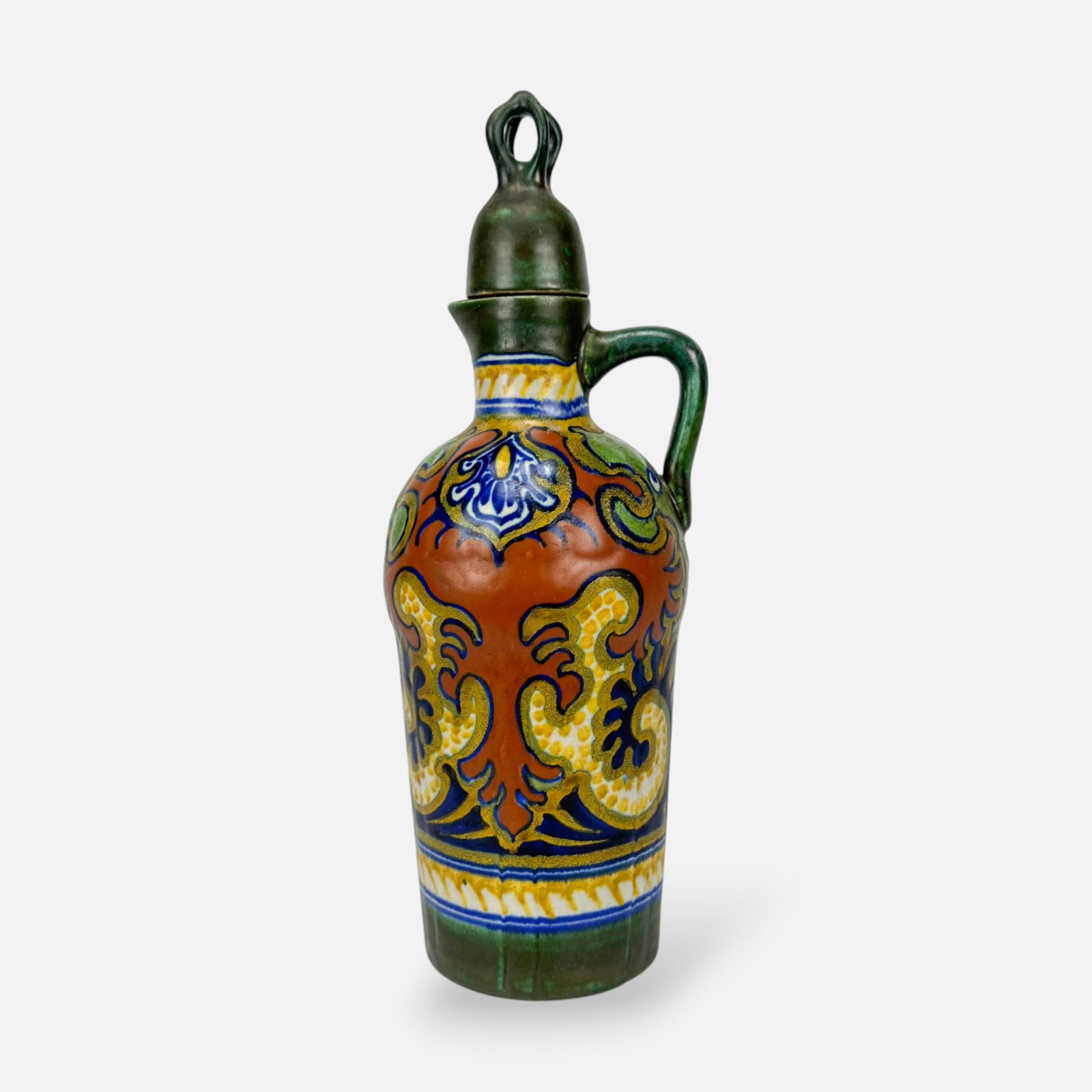 Gouda Zuid-Holland Dutch Art Pottery "Rhodian" Pattern Lidded Bottle Jug: Ca. early 20thC. Very good as shown. Free from any chips, cracks, or repairs.