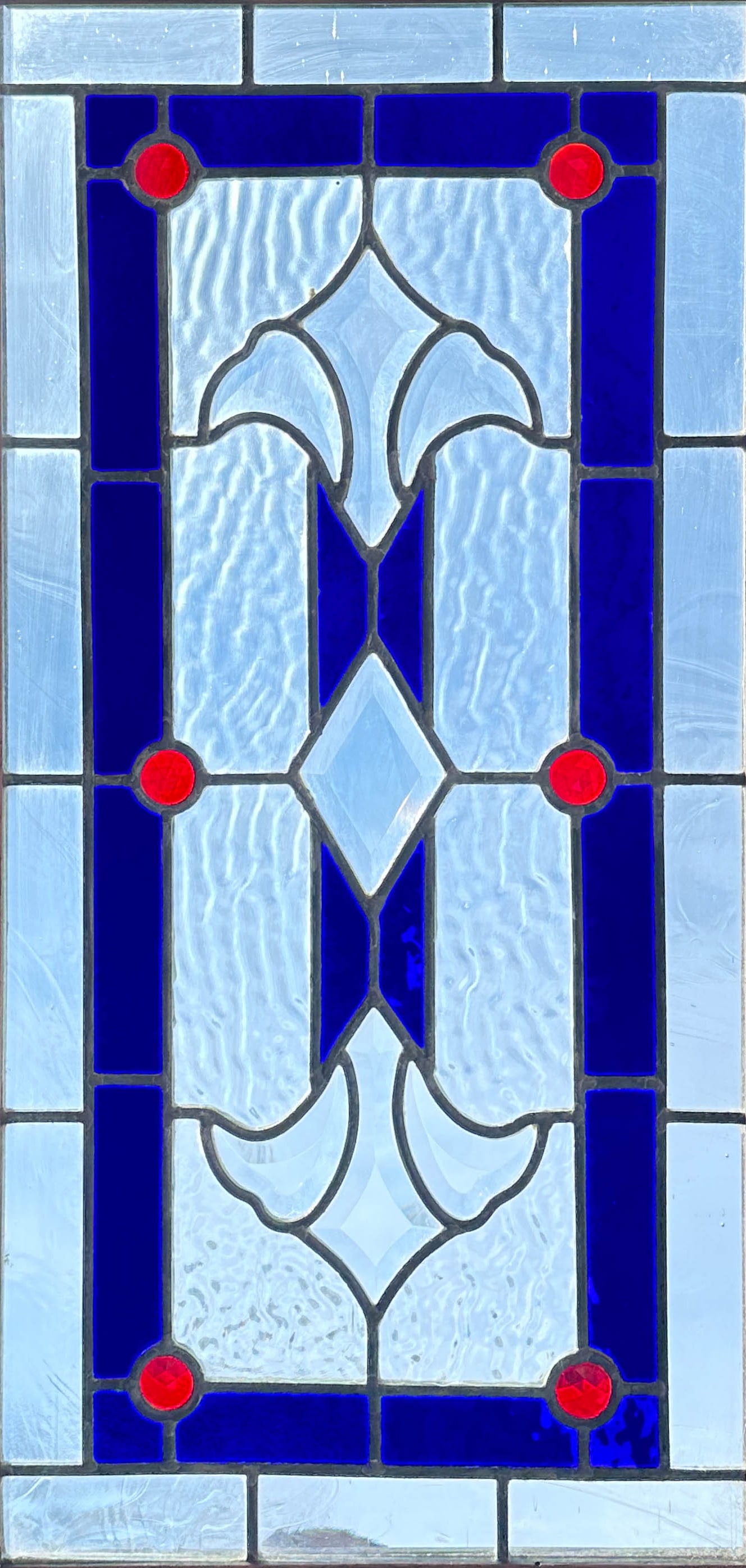 Antique Leaded Stained Glass Transom Window w/Four Jewels and Chestnut Frame: Ca. first quarter 20thC. Very good with no breaks, repairs or replacements.