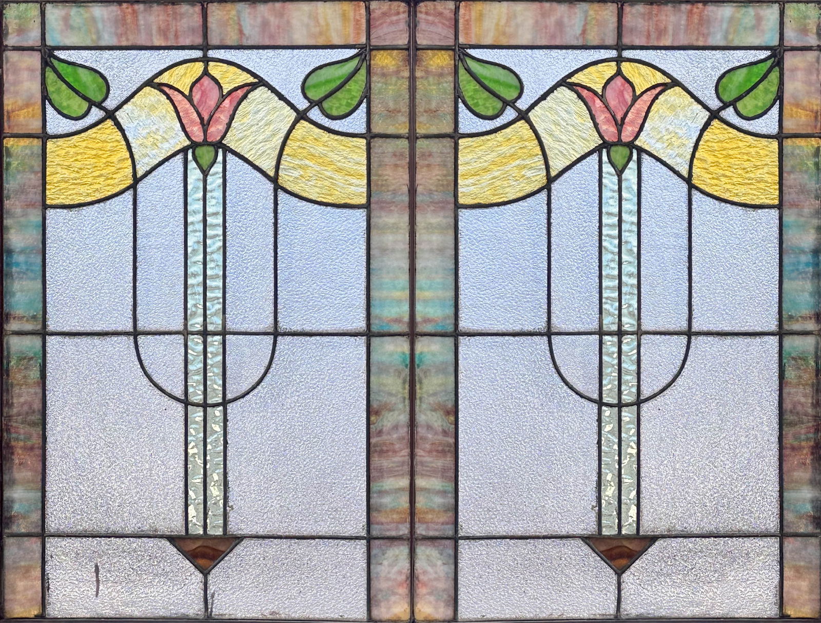 Pair Antique Arts & Crafts Tulip Leaded Stained Glass Windows: Ca. first quarter 20thC. Very good with no apparent or obvious breaks, repairs or replacements.