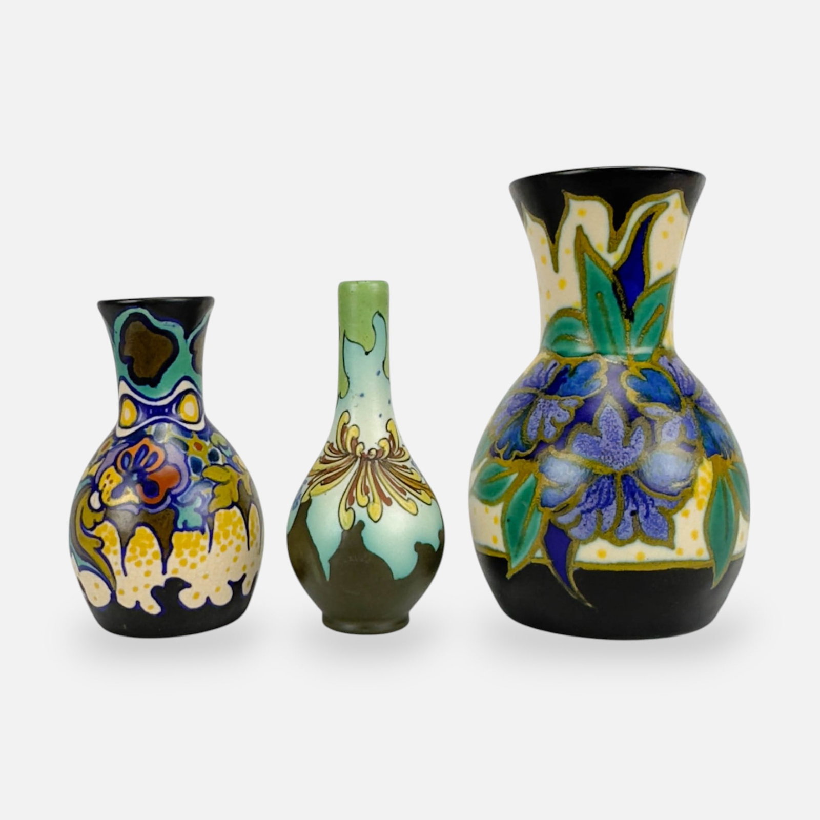 Three Gouda Zuid-Holland Dutch Art Pottery Vases: Ca. early 20thC. Very good as shown, with minor paint loss. Two minor dings to mouth of largest vase. Otherwise, no other chips, cracks, or repairs. Largest vase measurements included in listing. Smal