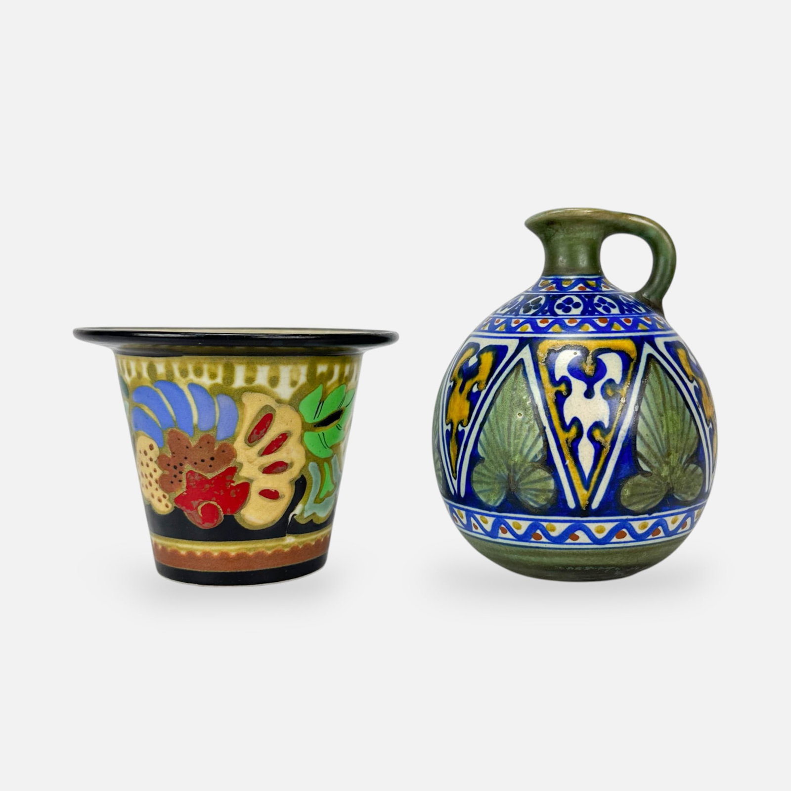 Gouda Zuid-Holland Dutch Art Pottery Jardiniere and Jug: Ca. early 20thC. Good as shown, with minor paint loss. Free from any chips, cracks, or repairs. Larger vase measurements included in listing. Jardiniere measures approx. 3 3/4" x 5". Jug measurements 