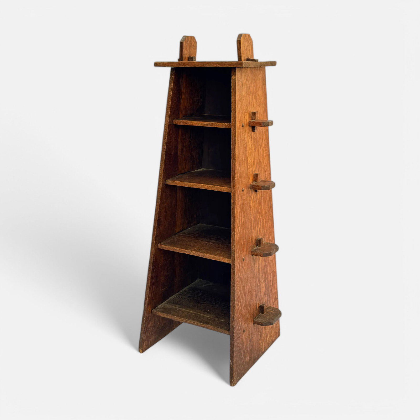 Arts & Crafts Mission Oak Four-Compartment Trestle Bookshelf Stand: Ca. first quarter 20thC. Very good with no apparent breaks or repairs. Surface darkening to top, possibly burn to top (see last picture).