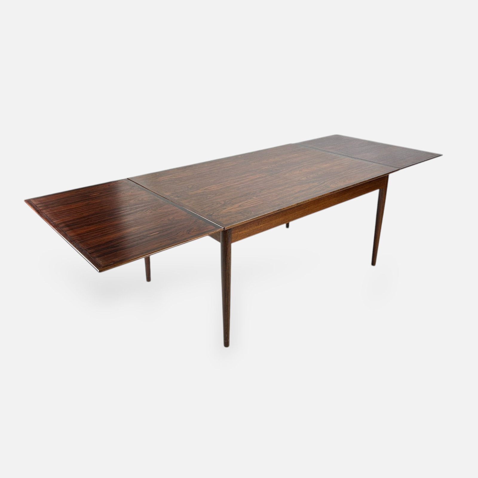 Hornslet Mobelfabrik Danish Modern MCM Rosewood Extending Dining Table: Very good to good condition, with age-appropriate surface wear and discoloration. Some moderately deep scratches are the only condition issues keeping this piece from being very good, please enlarge p