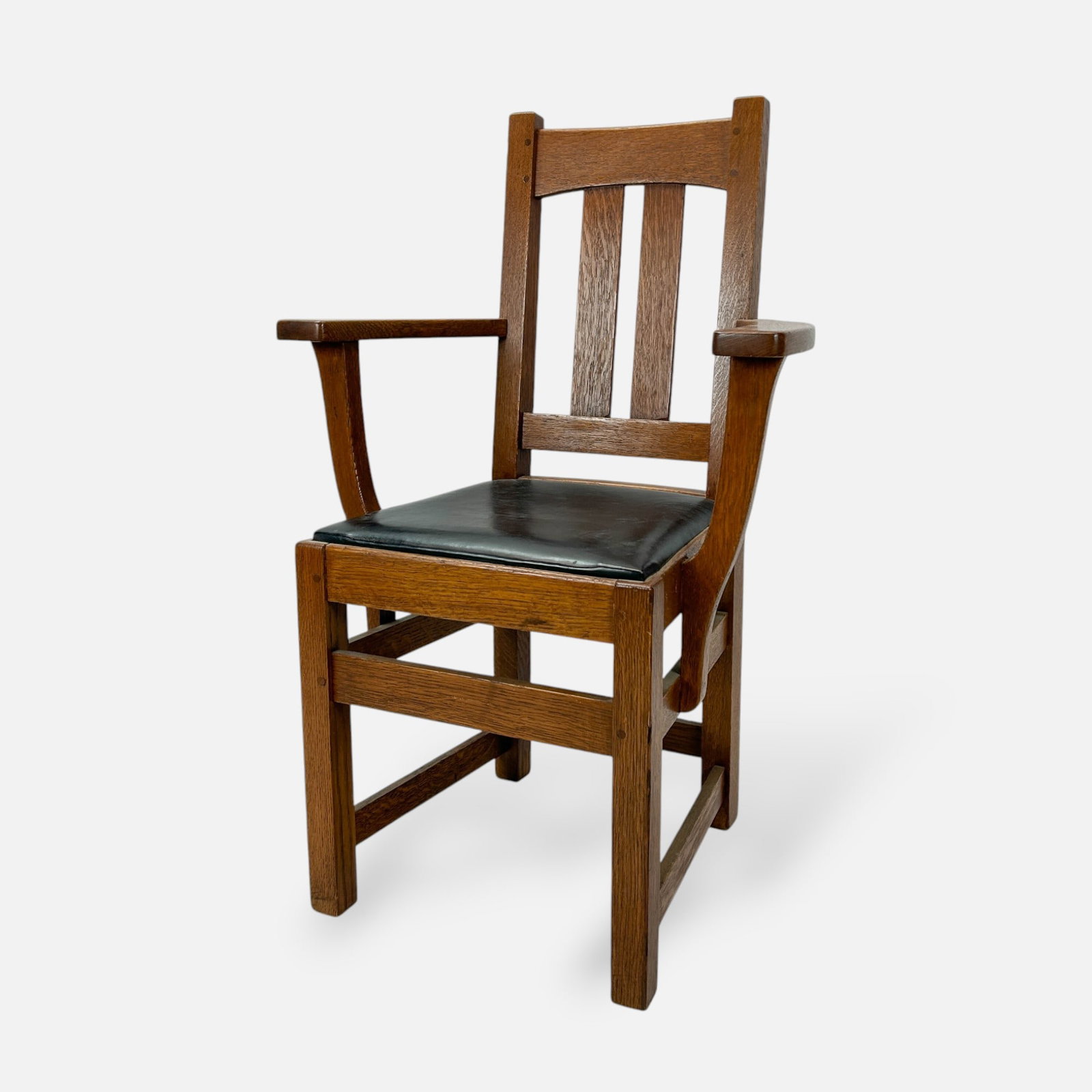 Limberts Arts & Crafts Mission Oak Dining Armchair: Ca. first quarter 20thC. Good age-appropriate condition, with surface wear consistent with age and use. Retains original finish throughout. Likely replaced leather seat. Brand on bottom of arm. Approx