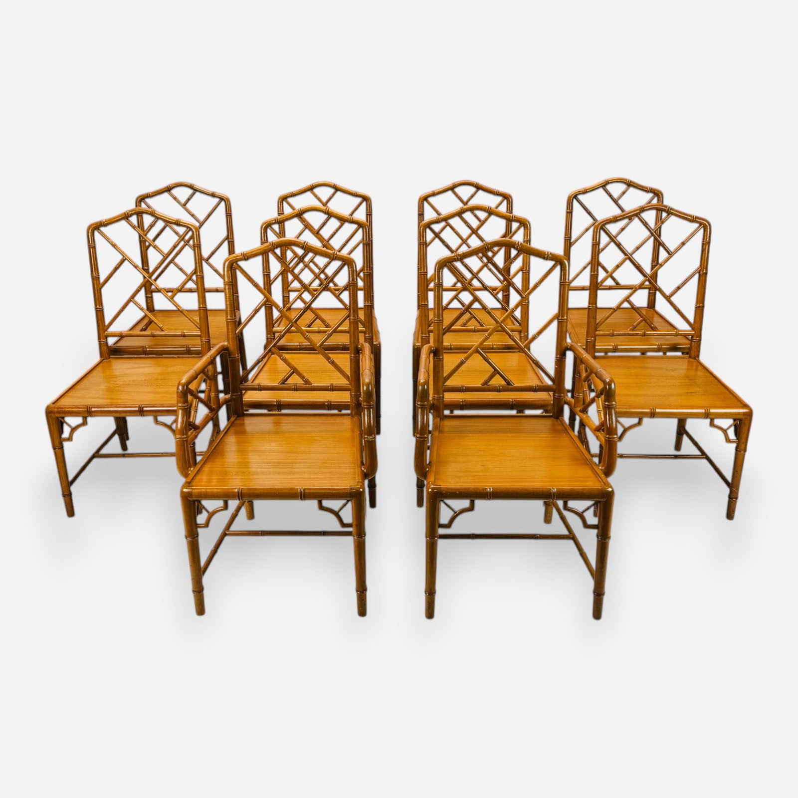 Set of Ten Chinese Chippendale Style Faux Bamboo Carved Wood Dining Chairs: Ca. second half 20thC. No missing components, no major breaks or repairs. This set of ten chairs retains original finish and patina, with occasional seam separations and surface scuffs. The cushions a