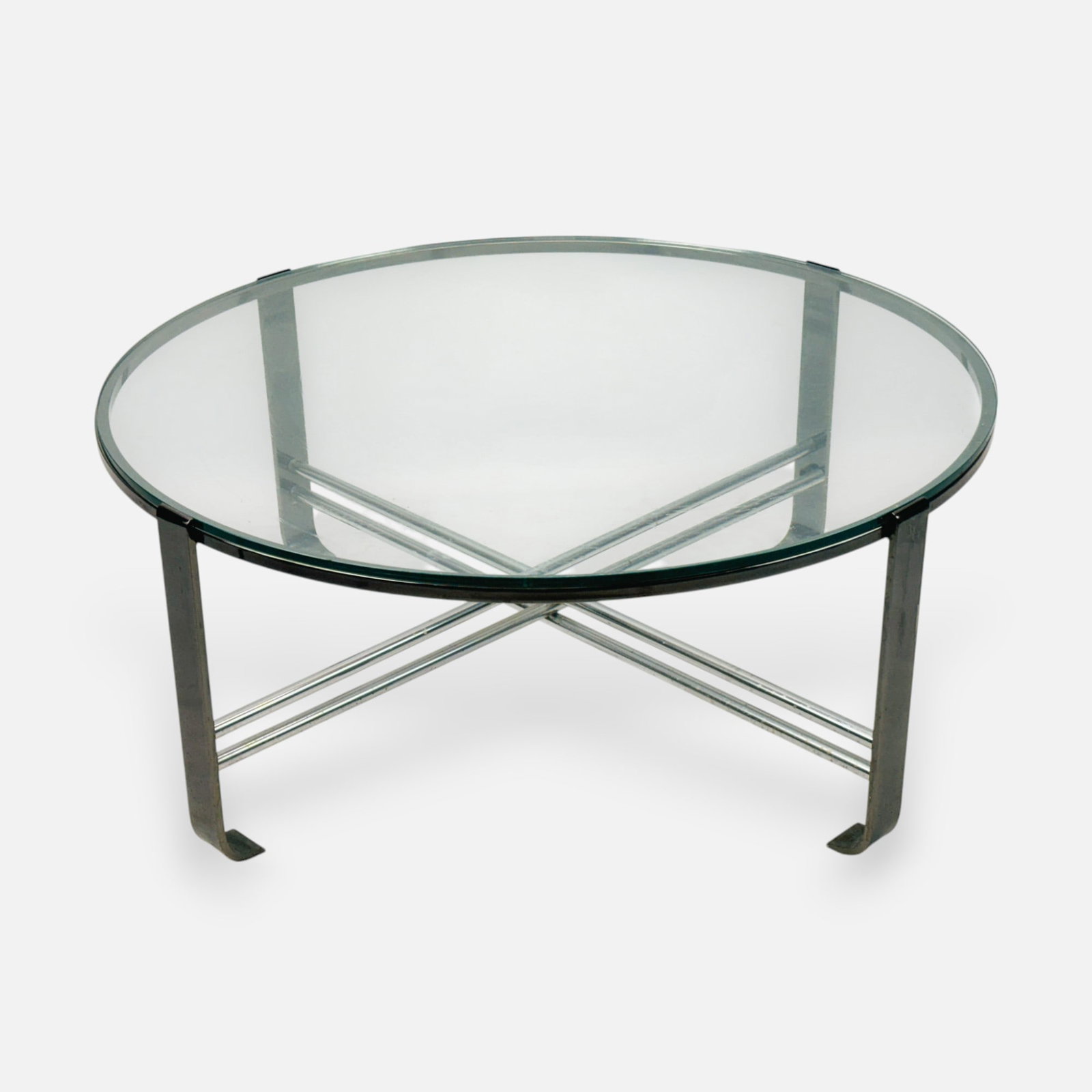 Design Institute America Chrome and Glass Modernist Circular Coffee Table: Design Institute America Chrome and Glass Circular Coffee Table. Good age-appropriate surface wear, discoloration. Glass free from any chips, etc. A few moderate scratches to glass surface.