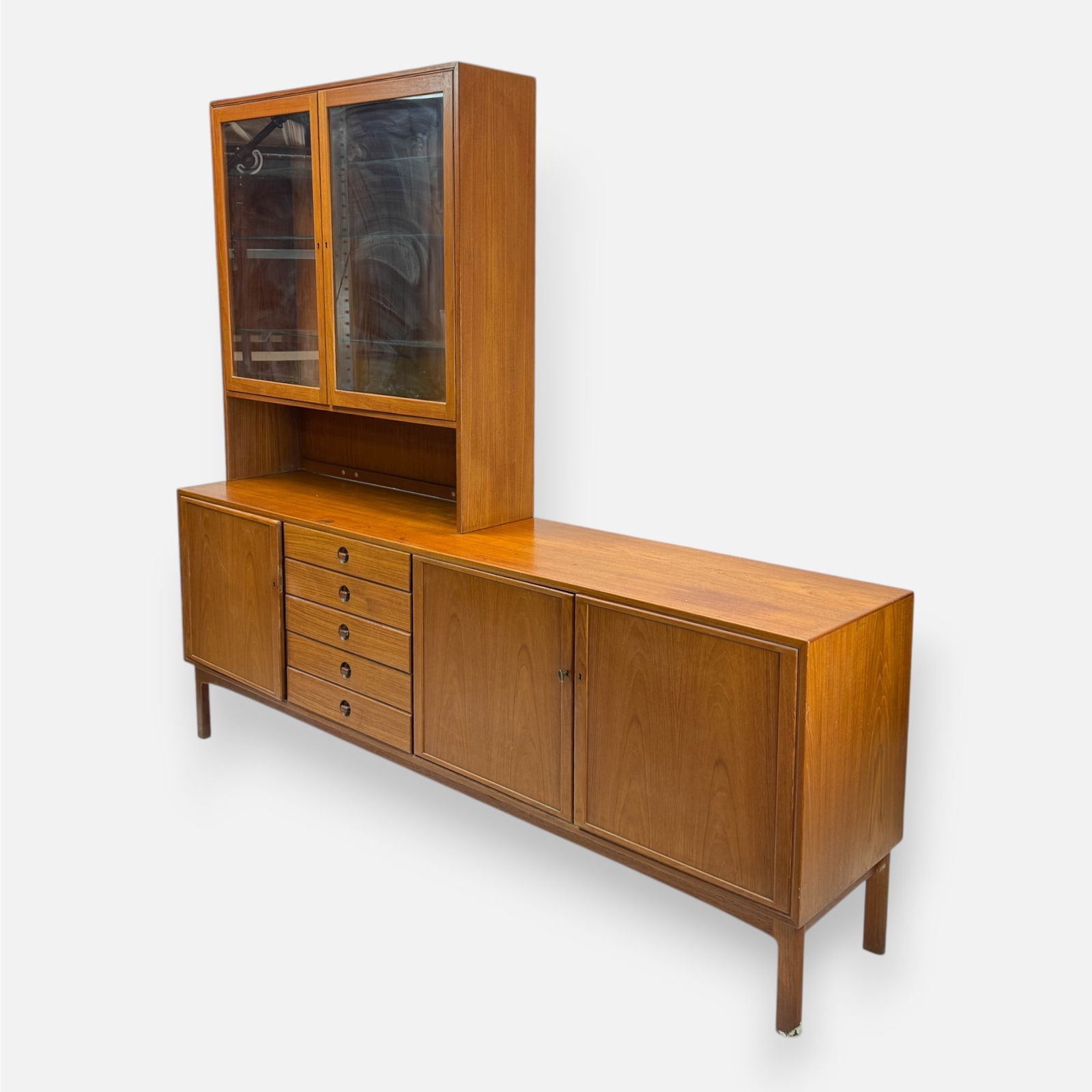 Scandinavian MCM Teak Credenza and Hutch Danish Modern: Exhibits a "Skaraborgs Mobelindustri AB Tibro Sweden" sticker. Good overall condition, with age-appropriate surface scuffs, scratches, and discoloration. See dark discoloration to surface.