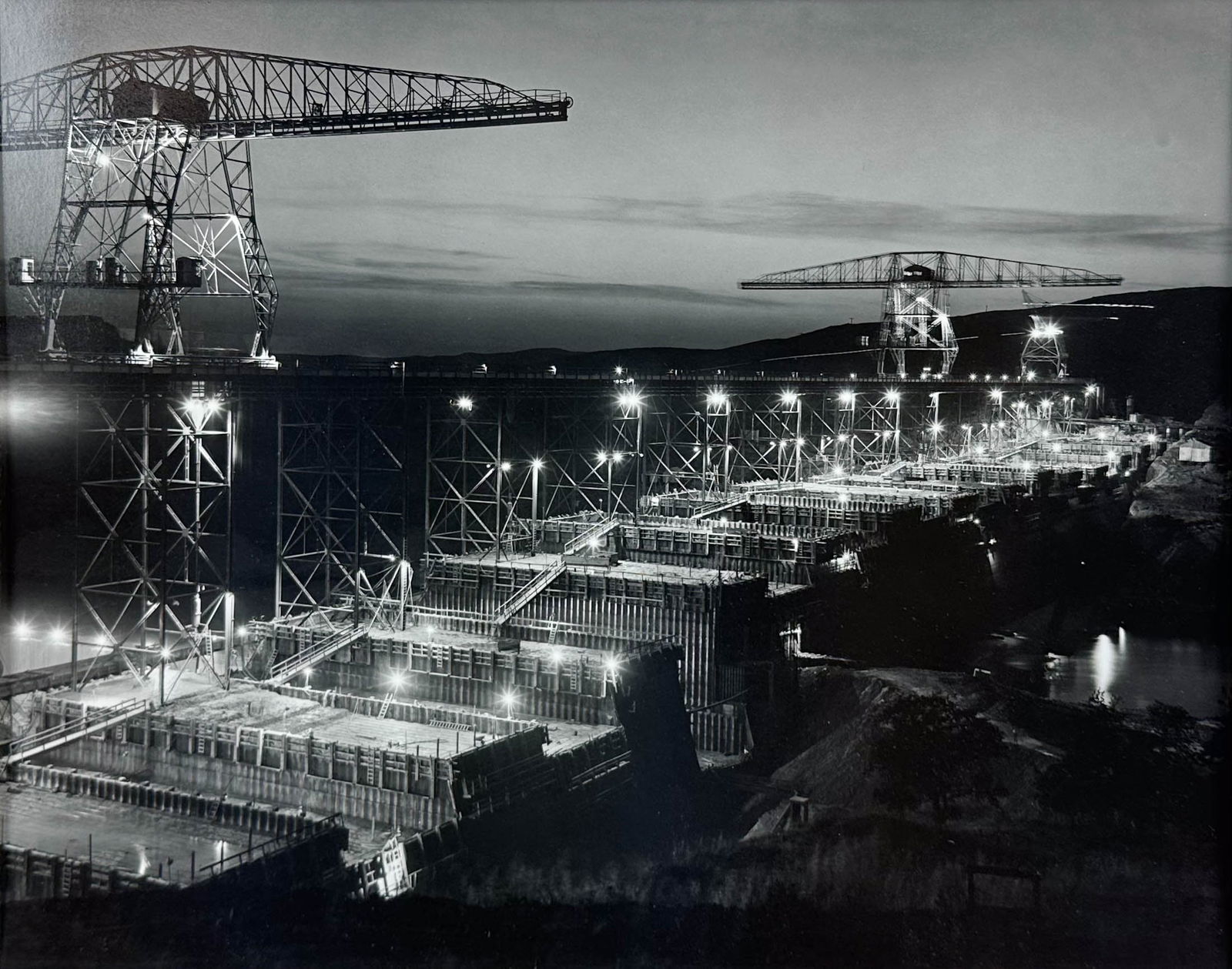 Ben Glaha Original Black and White 1935 Photograph "Boulder Dam at Night": Ca. 20thC. Excellent sight condition, with no rips or repairs. We will remove this from the frame to show both front and back.