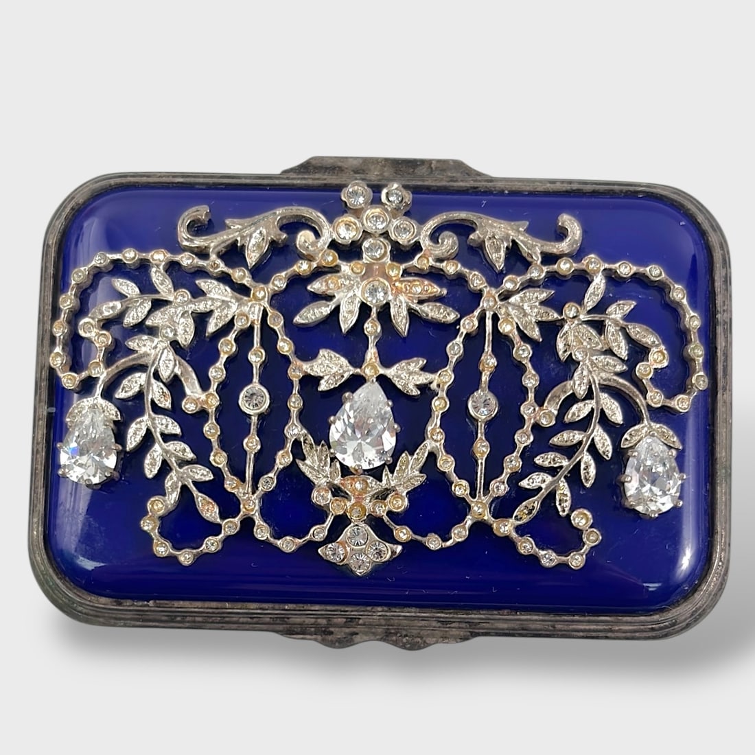 Fine Halcyon Days Enamels "The Corsage" Trinket Box: Missing Rhinestones Measures approx. 2 1/2 inch x 1 5/8 inch x 1 inch. Missing rhinestones. We do not provide in-house shipping! We have a partnership with our local UPS Store which offers a simple pa