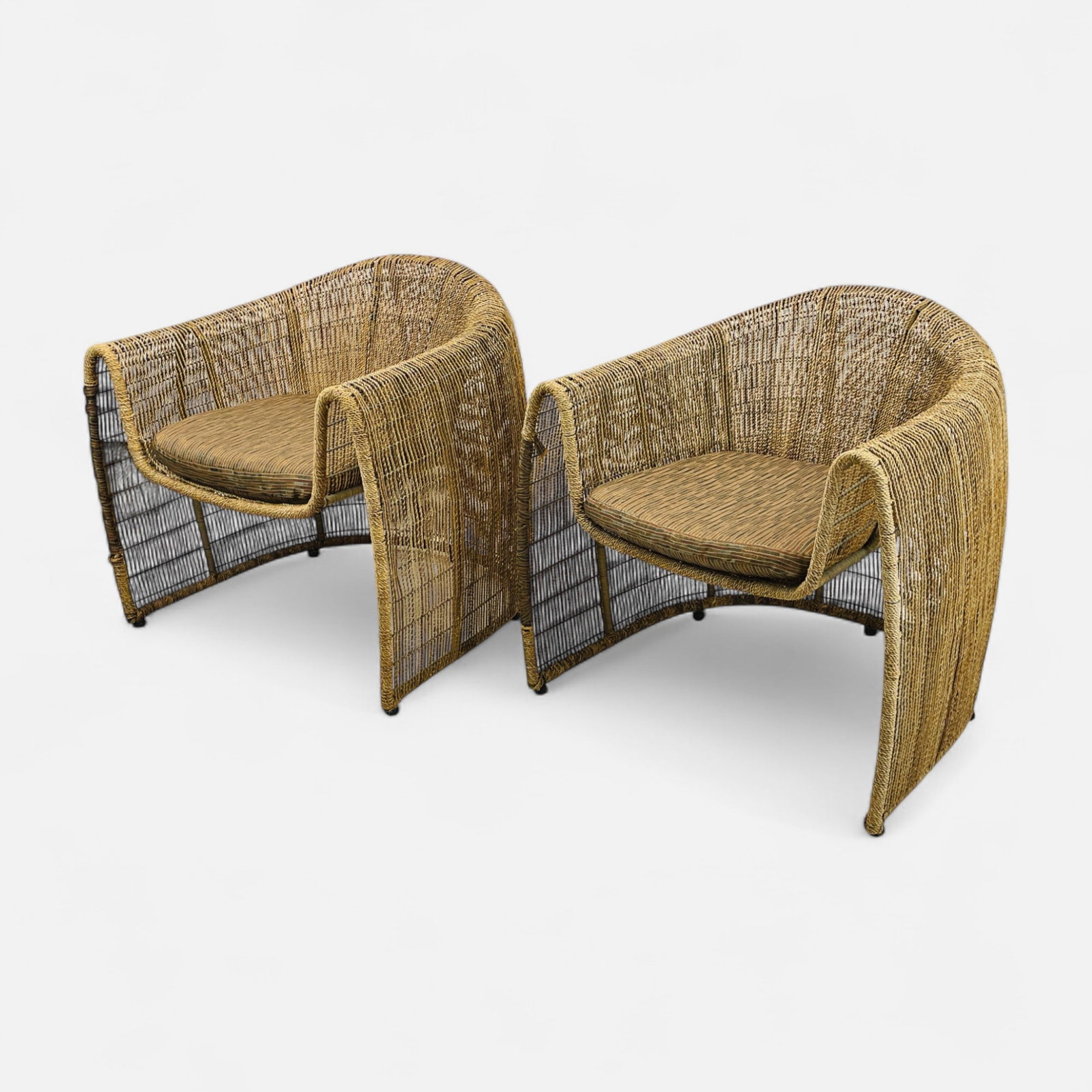 Pair Kenneth Cobonpue "Lulu" Abaca Fiber and Steel Club Chairs: Ca. early 21stC. Very Good overall condition, with minor surface wear. Simple integrated shipping with LiveAuctioneers LiveShipping is now available. Bidders may still arrange their own shipping which