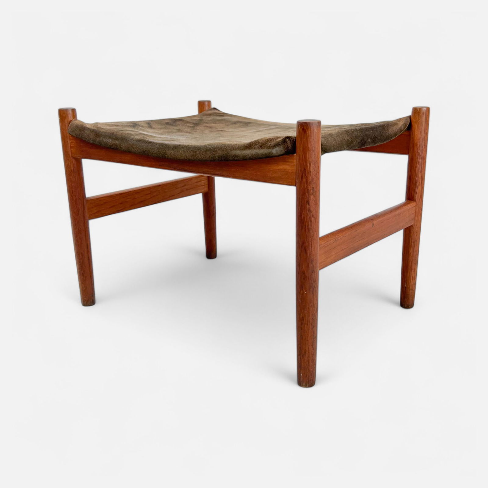 Spottrup Mobelfabrik Danish Modern MCM Teak Wood Footstool: Ca. last half 20thC. Very good wood with no major dents, dings or repairs. The attached fabric is an later addition. Apparently unmarked. Simple integrated shipping with LiveAuctioneers LiveShipping i