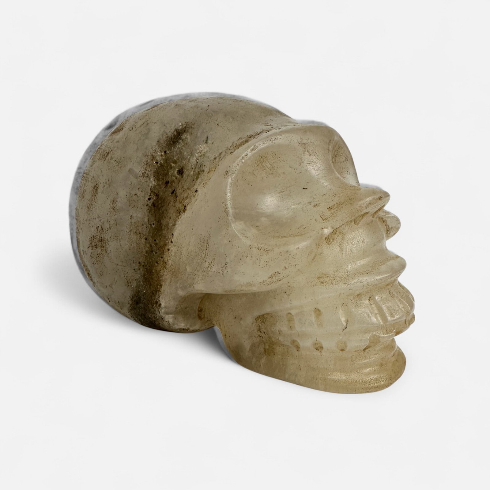 Carved Natural Selenite Crystal Skull Sculpture: Good as shown, free of any apparent breaks or repairs. Simple integrated shipping with LiveAuctioneers LiveShipping is now available. Bidders may still arrange their own shipping which may be more eco