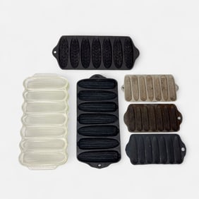 Eight Griswold & Wagner Cast Iron & Glass Corn Pans