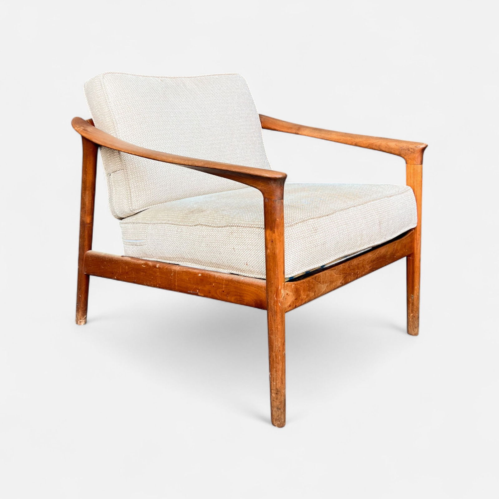 Folke Ohlsson Mid Century Danish Modern Teak Lounge Chair: Ca. second half 20thC. Fair condition as shown. See discoloration, scuffs, and scratches to wood surfaces. IMPORTANT: Pickups and shipping for this auction will not begin until after Labor Day. Pickup