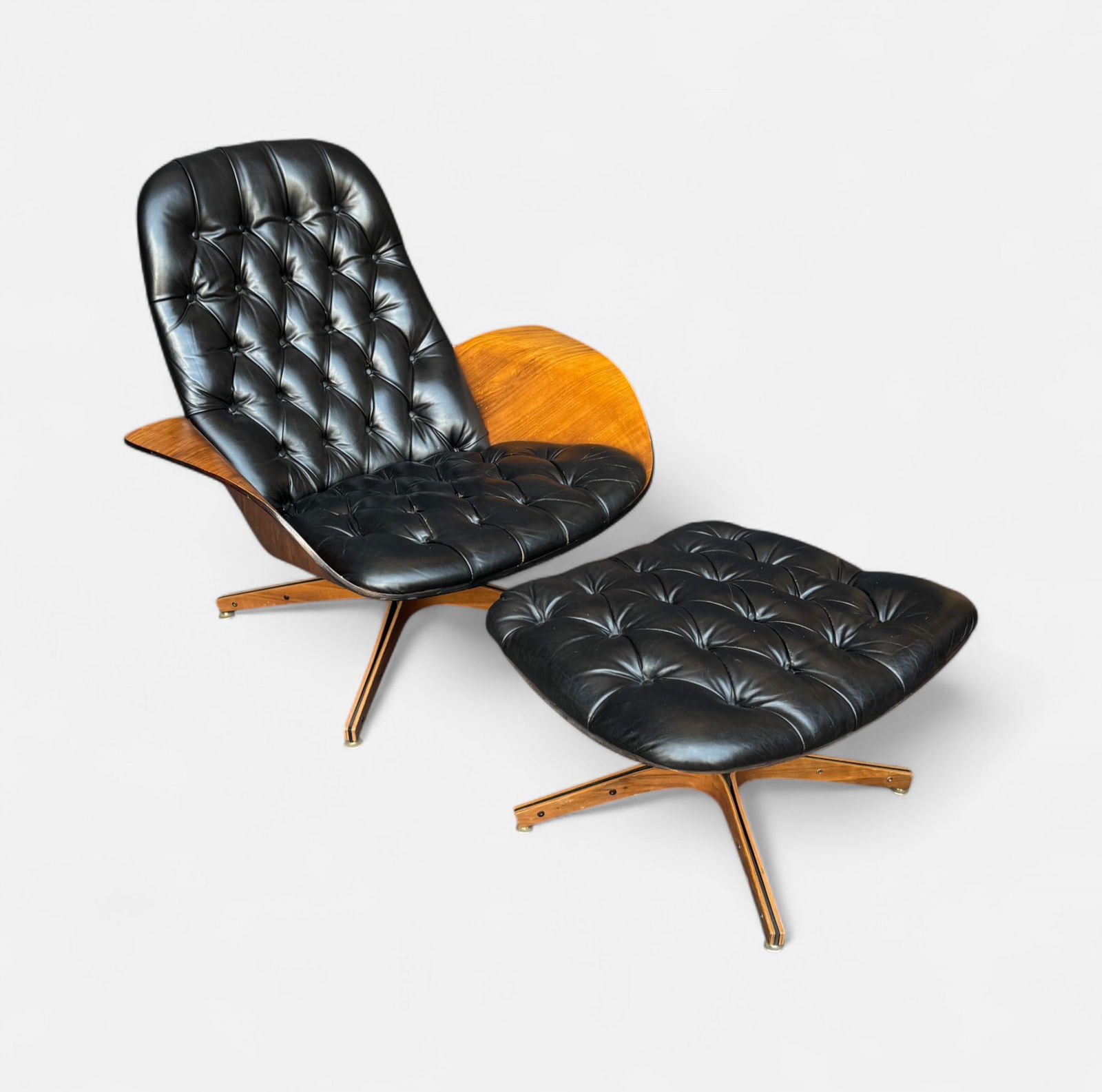 Plycraft for George Mulhauser MCM Tufted Leather Lounge Chair and Ottoman: Fair to good age-appropriate condition, chair lifts off the base. Ottoman measures approx. 14 1/2" x 22 1/4" x 21". Lounge chair dimensions included in listing. IMPORTANT: Pickups and shipping for thi