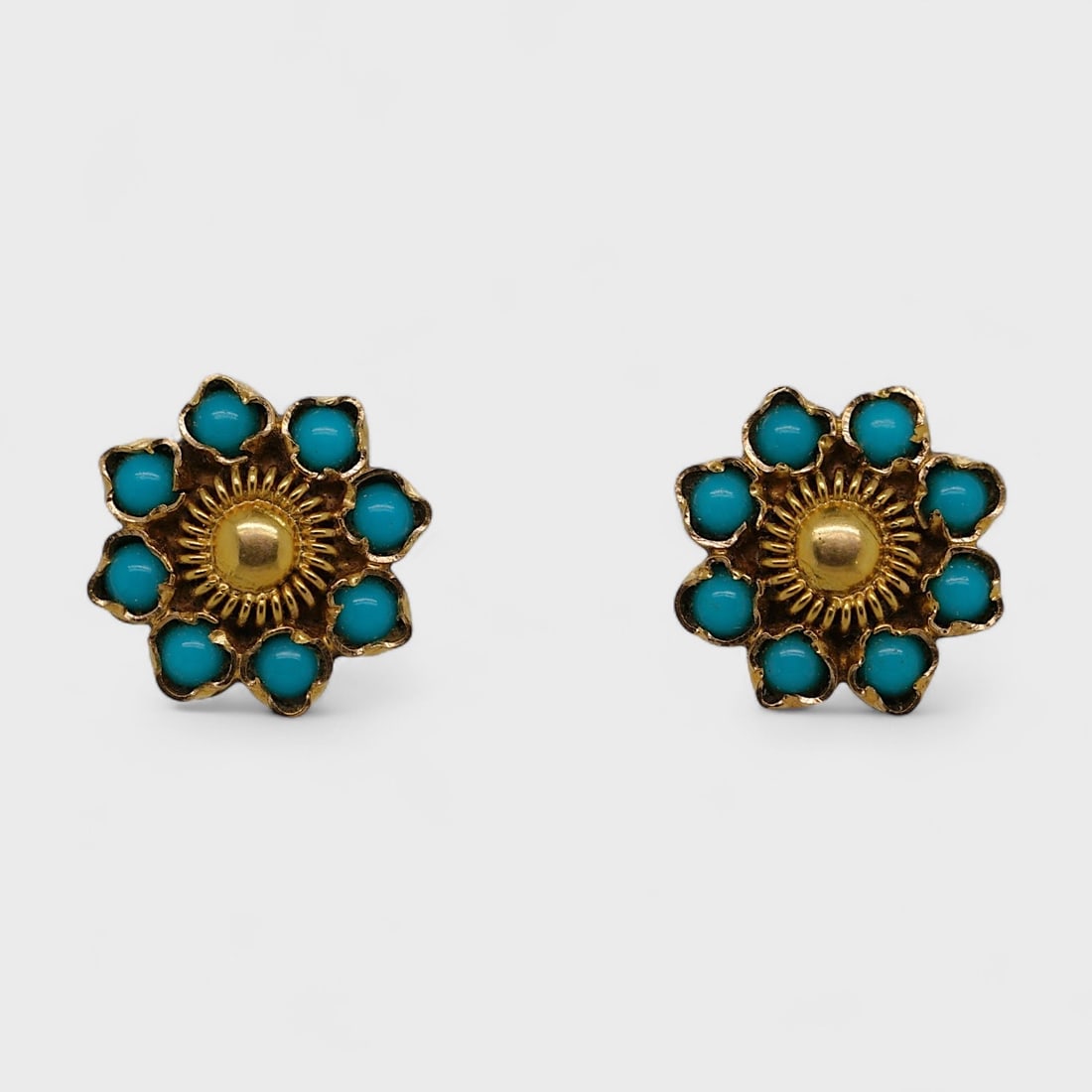 Fine 18K Yellow Gold Simulated Turquoise Petal Form Pierced Screwback Earrings: Combined weight 1.8 grams. Measure approx. 7/16 inches in diameter.For shipping, please reach out to Donald Camden at UPS Store 4608 or elect for integrated shipping with LiveAuctioneers LiveShipping.
