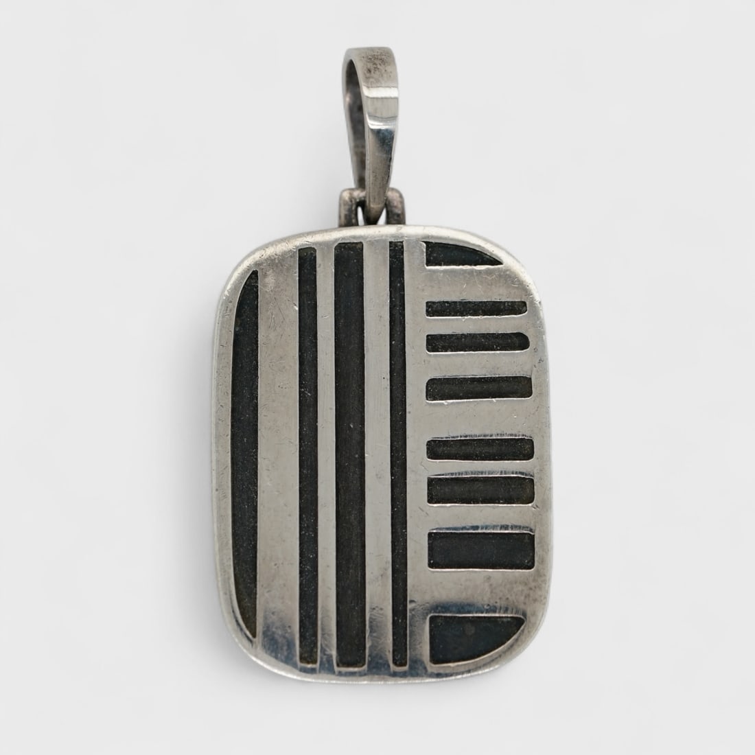 Burle Marx Sterling Silver & Enamel Modernist Pendant: Ca. last quarter 20thC. Weighs 6 grams. Measures approx. 1 3/8 inches x 3/4 inches. Measures 1/8 inches thick. For shipping, please reach out to Donald Camden at UPS Store 4608 or elect for integrated