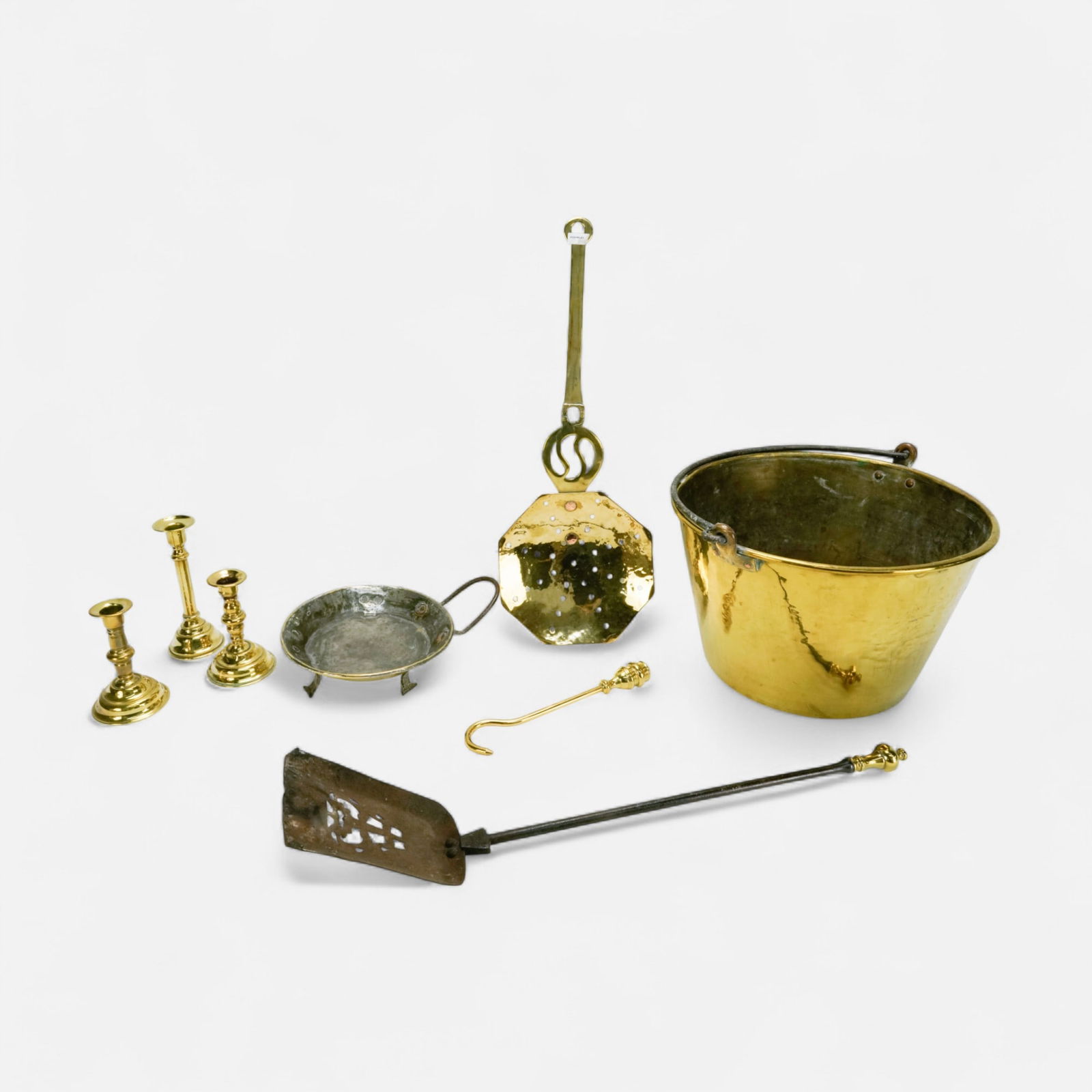 Antique Brass and Iron Objects: Candlesticks Pail Shovel Sifter Hook Pan: Ca. 19thC. All is used condition with age-appropriate dings and wear. The dimensions are for the handled pail.For shipping, we highly recommend Donald Camden at UPS Store 4608. Alternatively, reach ou