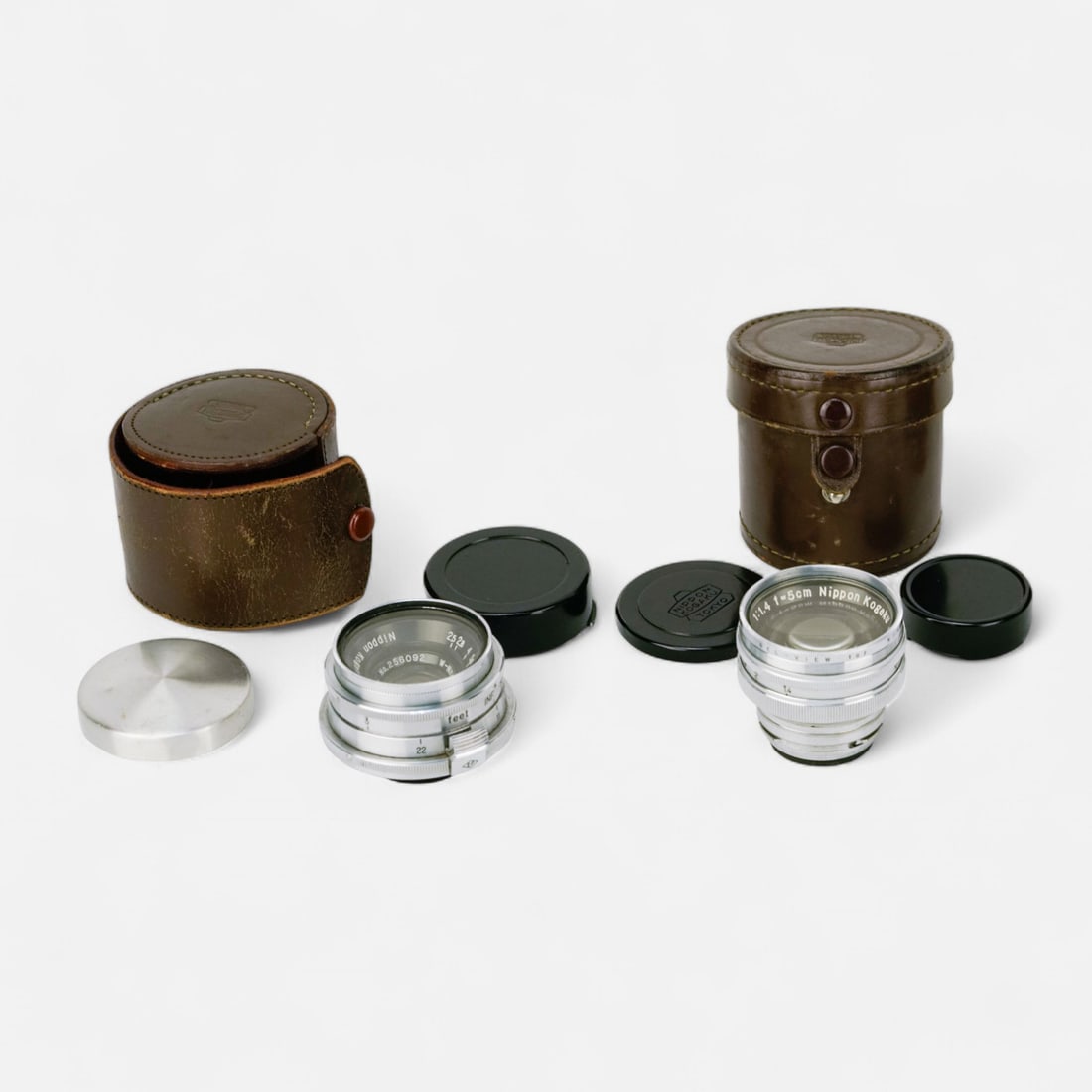 Two Nikkon Nippon Kogaku Lenses 3.5cm & 5cm: Used condition as shown, untested.For shipping, we highly recommend Donald Camden at UPS Store 4608. Alternatively, reach out to one of our preferred shippers listed at the link below or elect for Liv