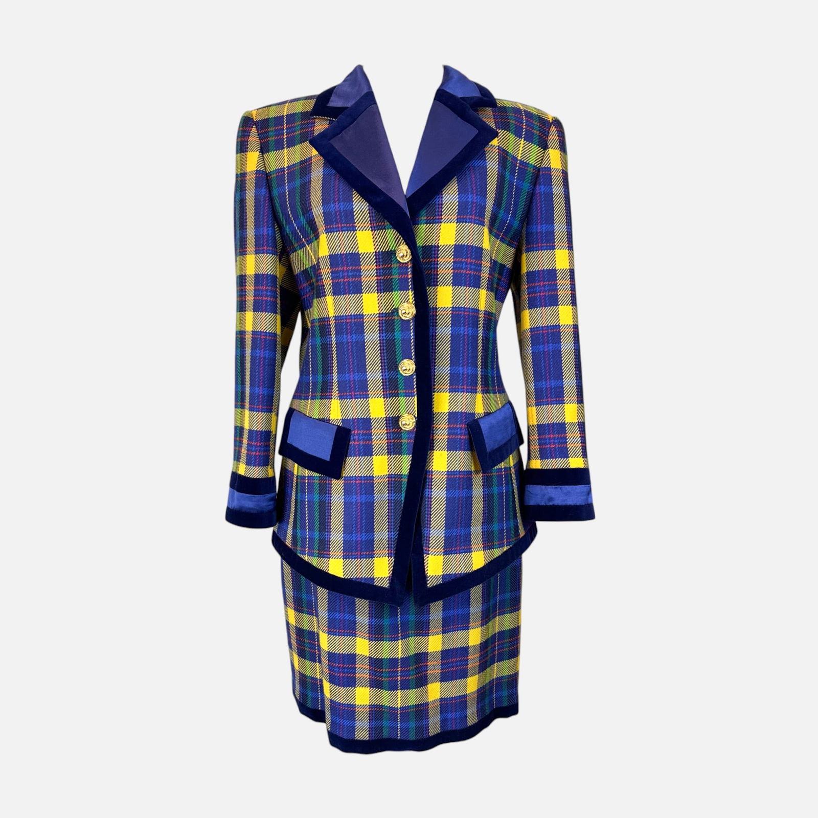 Vintage Escada Blue and Yellow Plaid with Blue & Black Detail Two-Piece Suit: Escada by Margaretha Ley, made in Germany. Fitted tailoring with statement buttons. Very good condition. Fabric Content: 100% New Wool, 77% Cotton, 23% Rayon. Top measures 29 inches long, 17.5 inches