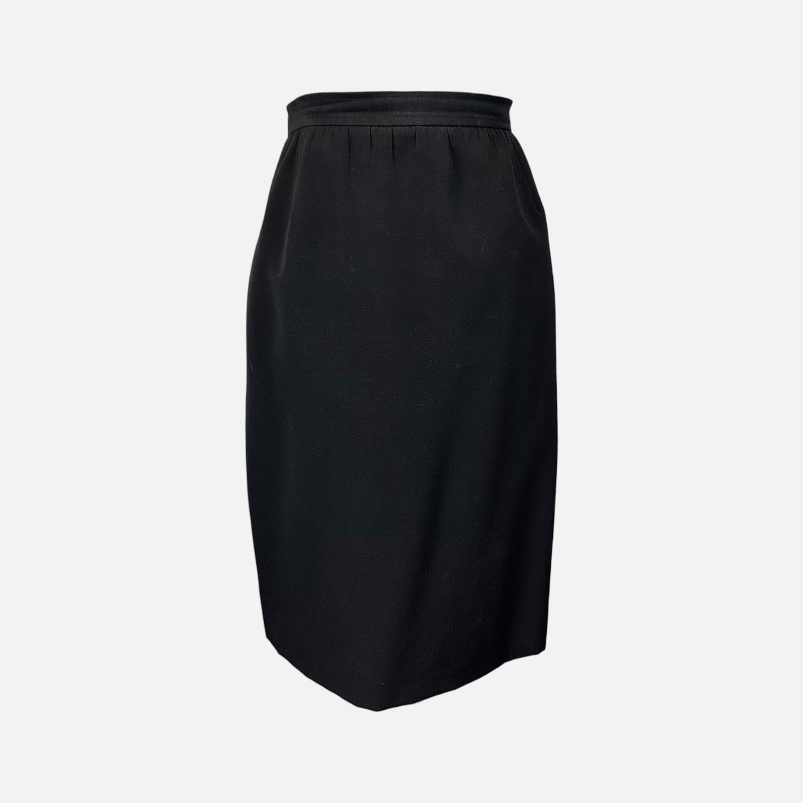 Vintage YSL Yves Saint Laurent Black Pencil Skirt: Rive Gauche, made in France. Very good condition. Fabric tag is missing. Measures 23.5 inches long and 14.25 inches at the waist. Size 42. For shipping, we highly recommend Donald Camden at UPS Store
