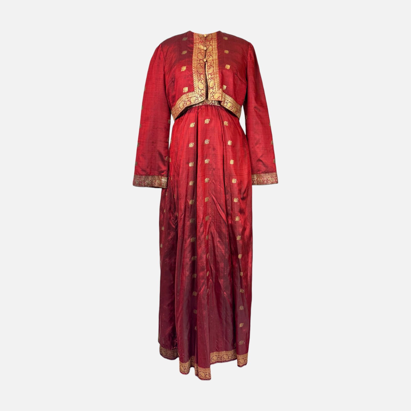 Vintage Unbranded Indian Red and Gold Silk Anarkali Gown with Brocade Jacket: Very good condition. possibly custom-made. Fabric Content: 100% Silk. Measures 57 inches long, 14 inches at the waist, 15.5 inches at the bust, 18 inches at the hips, and 15 inches at the shoulder. Si
