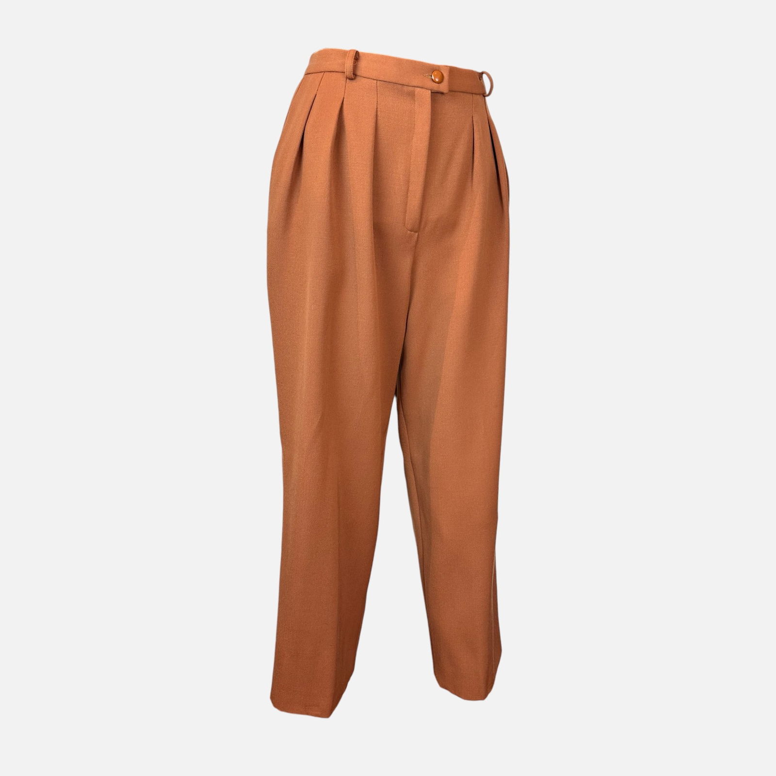 Vintage Christian Dior Rust Brown Pleated Wool Trousers: Made in France. Very good condition. High-waisted, double-pleated. Fabric content: 100% Wool. Measures 40 inches long and 14.25 inches at the waist. Size tag missing. For shipping, we highly recommend