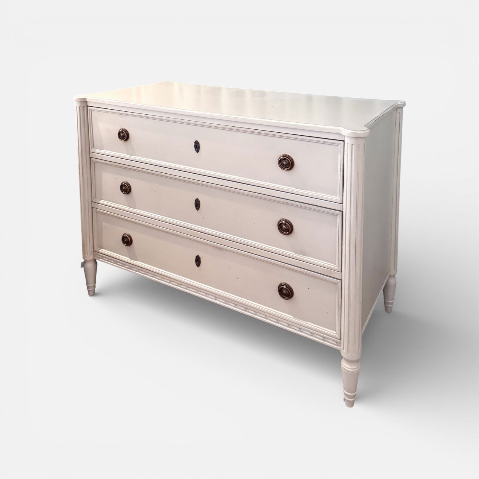 Redford House "Etienne" 3-Drawer Chest of Drawers: With French linen finish, brass pulls, fluted Column Legs, power outlet w/socket & USB port. Good with minor surface discoloration.For shipping, we highly recommend Donald Camden at UPS Store 4608.