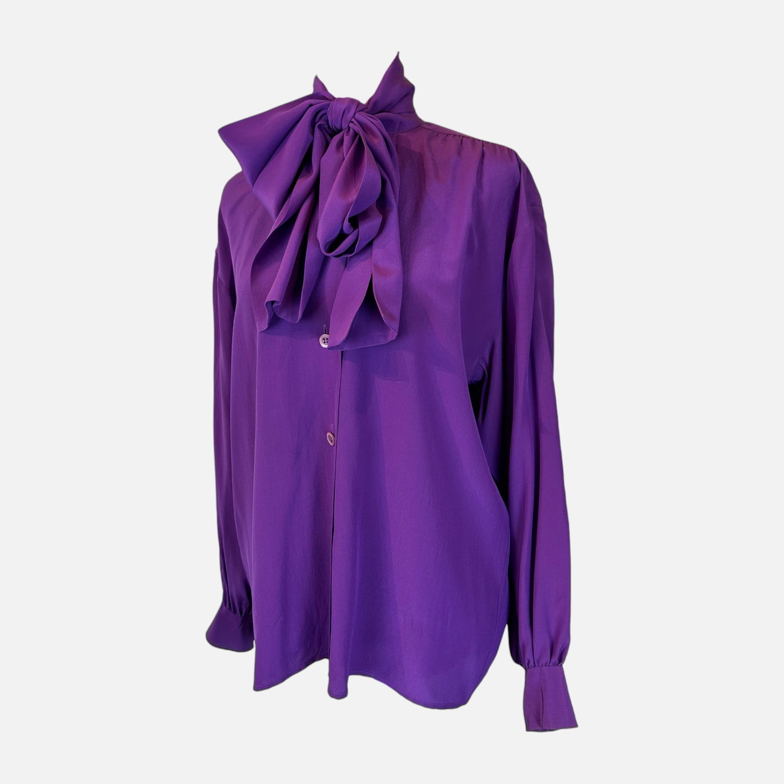 Yves Saint Laurent Vintage Violet Silk Blouse: Very good condition. Fabric tag is missing. Made in France. Top measures 27 inches long, 20 inches at the waist, 20 inches at the bust, and 21 inches at the shoulder. For shipping, we highly recommend