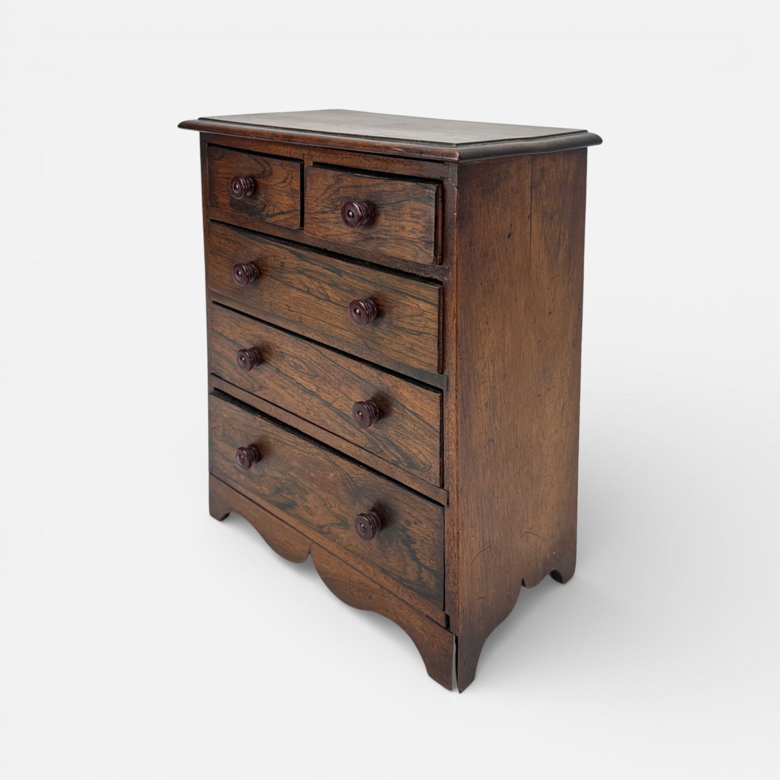 Antique 19thC English Miniature 5-Drawer Chest of Drawers: Good age-appropriate condition, with some veneer loss, seam seperation.For shipping, we highly recommend Donald Camden at UPS Store 4608. Alternatively, reach out to one of our preferred shippers list