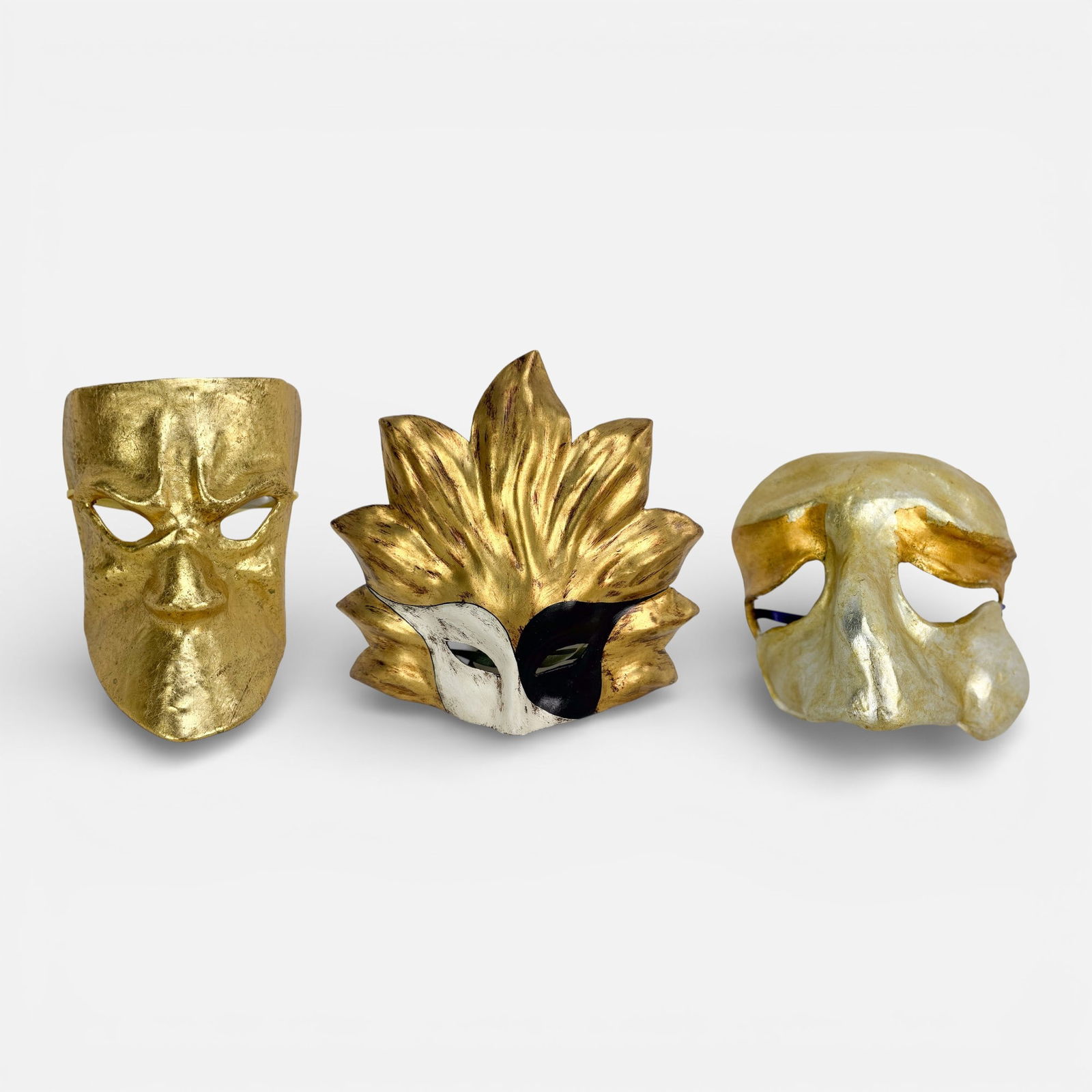 Three 1980s Venetian Masquerade Handmade Paper Mache Bright Gilt & Silver Painted Ball Masks: Two masks signed, one dated 1982.For shipping, we highly recommend Donald Camden at UPS Store 4608. Alternatively, reach out to one of our preferred shippers listed at the link below or elect for Live