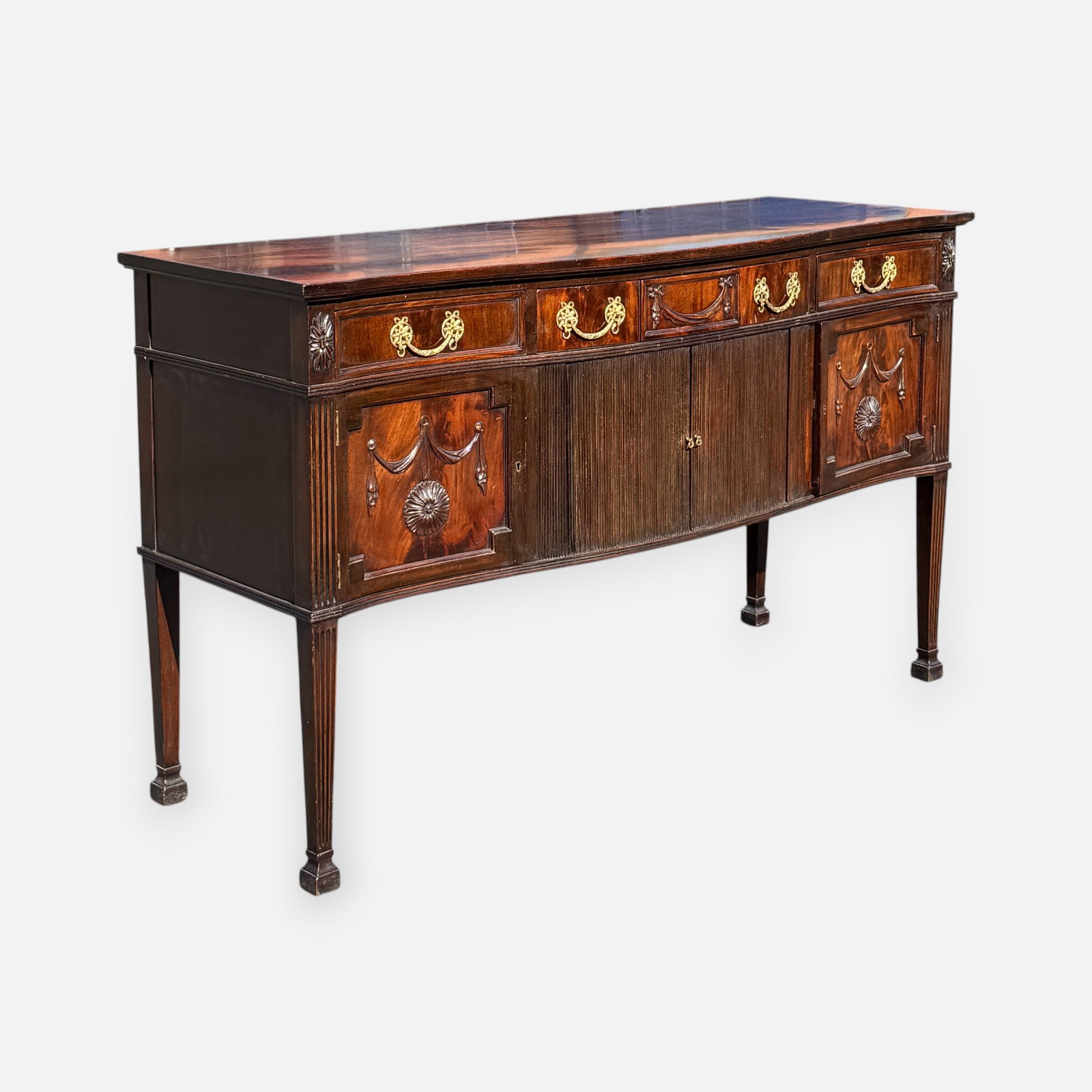 Early 20thC High End Bench Made Carved Mahogany Federal Sideboard w/Tambour Door & Brass Hardware: For shipping, we highly recommend Donald Camden at UPS Store 4608. Alternatively, reach out to one of our preferred shippers listed at the link below or elect for LiveShipping in the checkout screen.