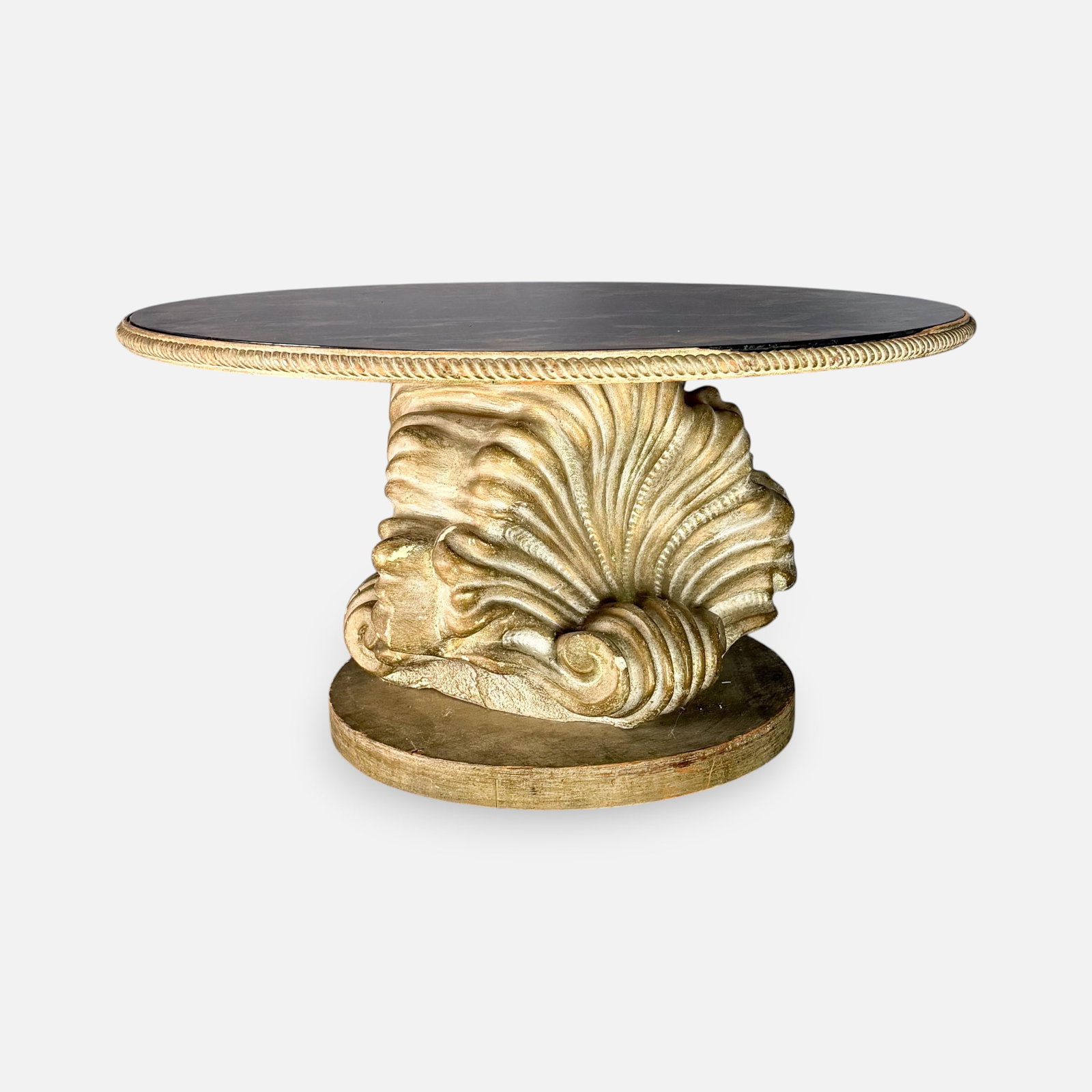1960s Hollywood Regency Molded Clamshell Gilt Gold Round Center Coffee Table: Scratches mostly to glass top that rests above faux painted marble. For shipping, we highly recommend Donald Camden at UPS Store 4608. Alternatively, reach out to one of our preferred shippers listed 