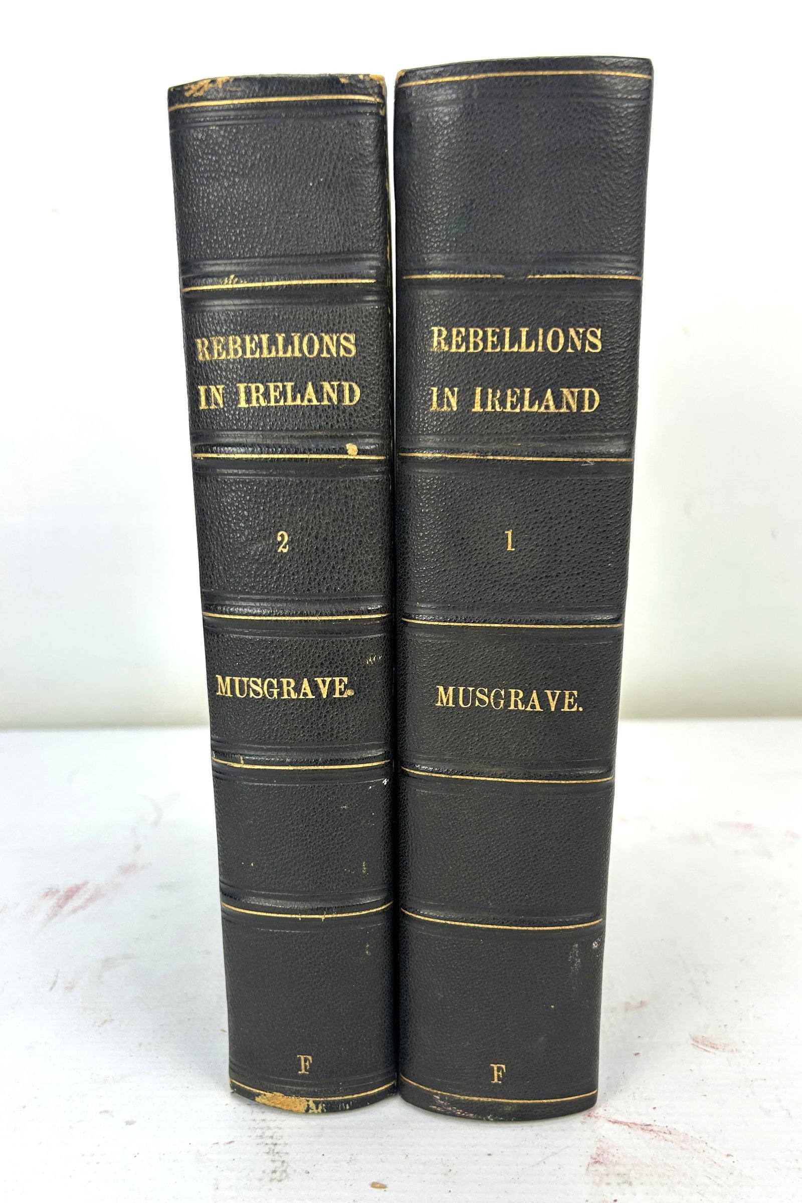 Two Volume Set by Sir Richard Musgrave Memoirs of The Irish Rebellion 1801 With Maps: 3/4 Morocco covers w/Marbleized end papers. This is a clean and rare second edition set. For shipping, we highly recommend Donald Camden at UPS Store 4608. Alternatively, reach out to one of our prefe