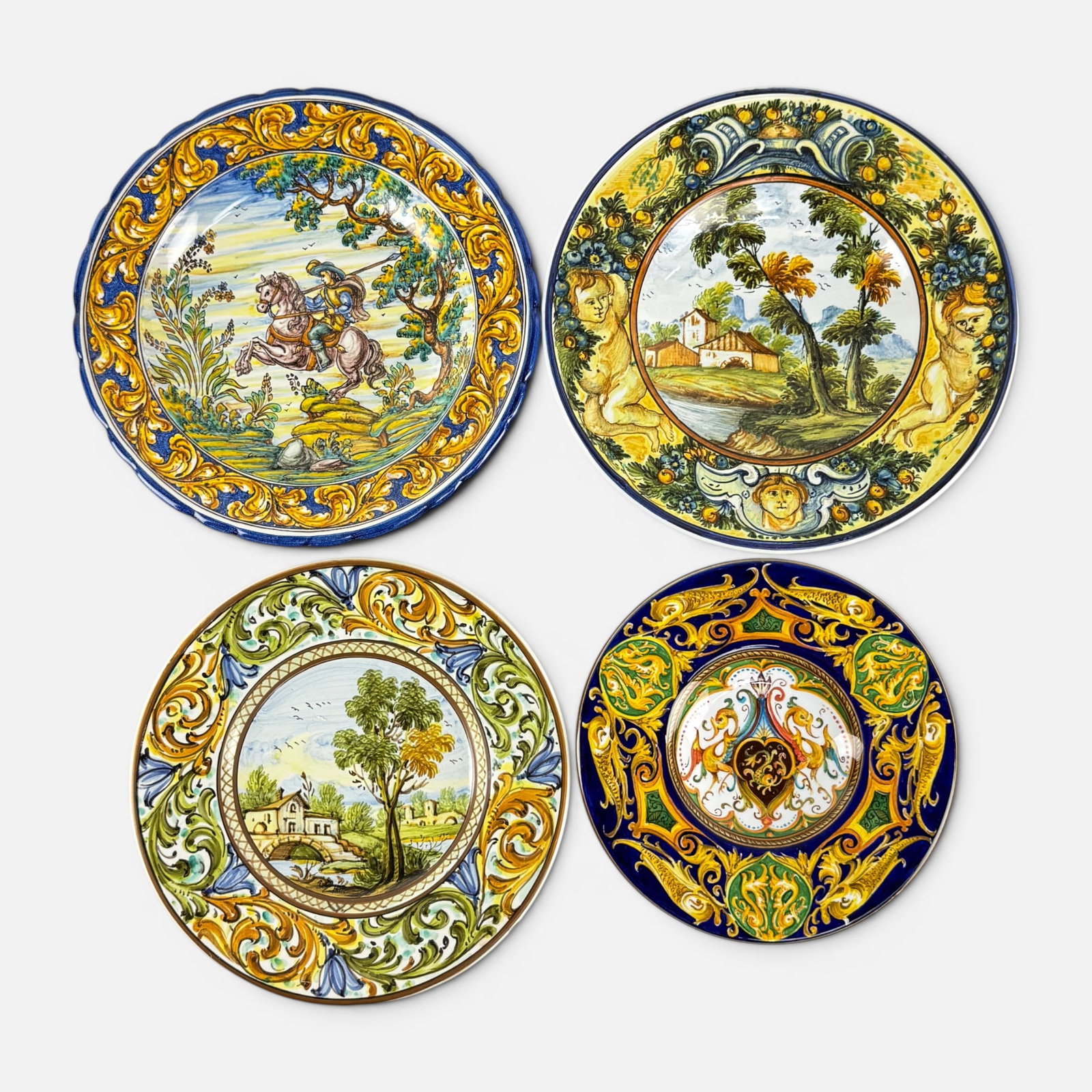 Four Spanish & Italian Paint Decorated Ceramic Chargers, Castelli, Talavera, and Laura Silvagni: Ca. late 20th to early 21stC. Very good with some minor paint loss/fading. No chips, cracks, or repairs. Largest charger measures approx. H: 1 1/2", W: 10 1/4", D: 10 1/4". For shipping, we highly rec