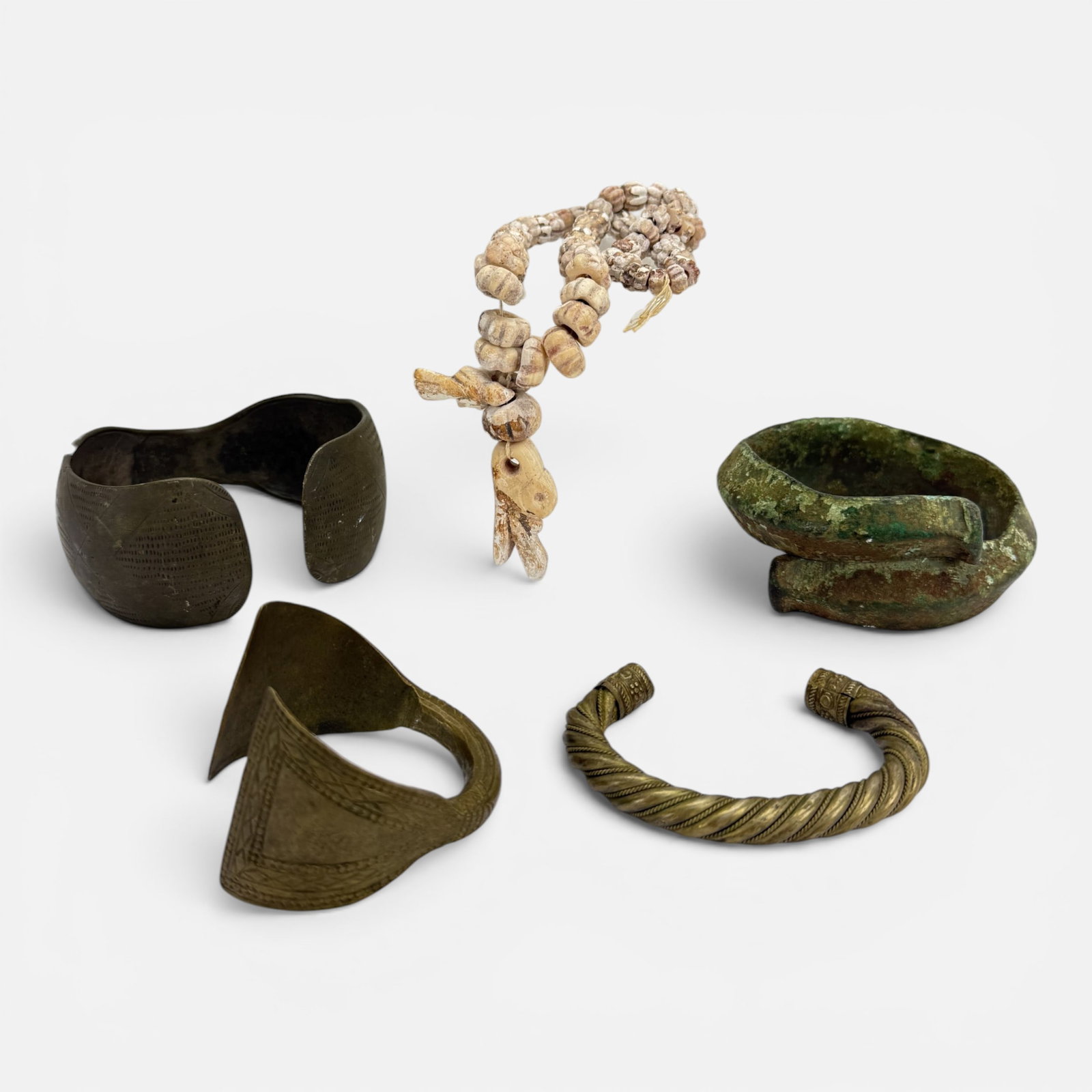 Five Antique Bronze, Metal Bracelets & Carved Stone Bead Necklace: Ca. 500 AD-19thC. For shipping, we highly recommend Donald Camden at UPS Store 4608. Alternatively, reach out to one of our preferred shippers listed at the link below or elect for LiveShipping in the
