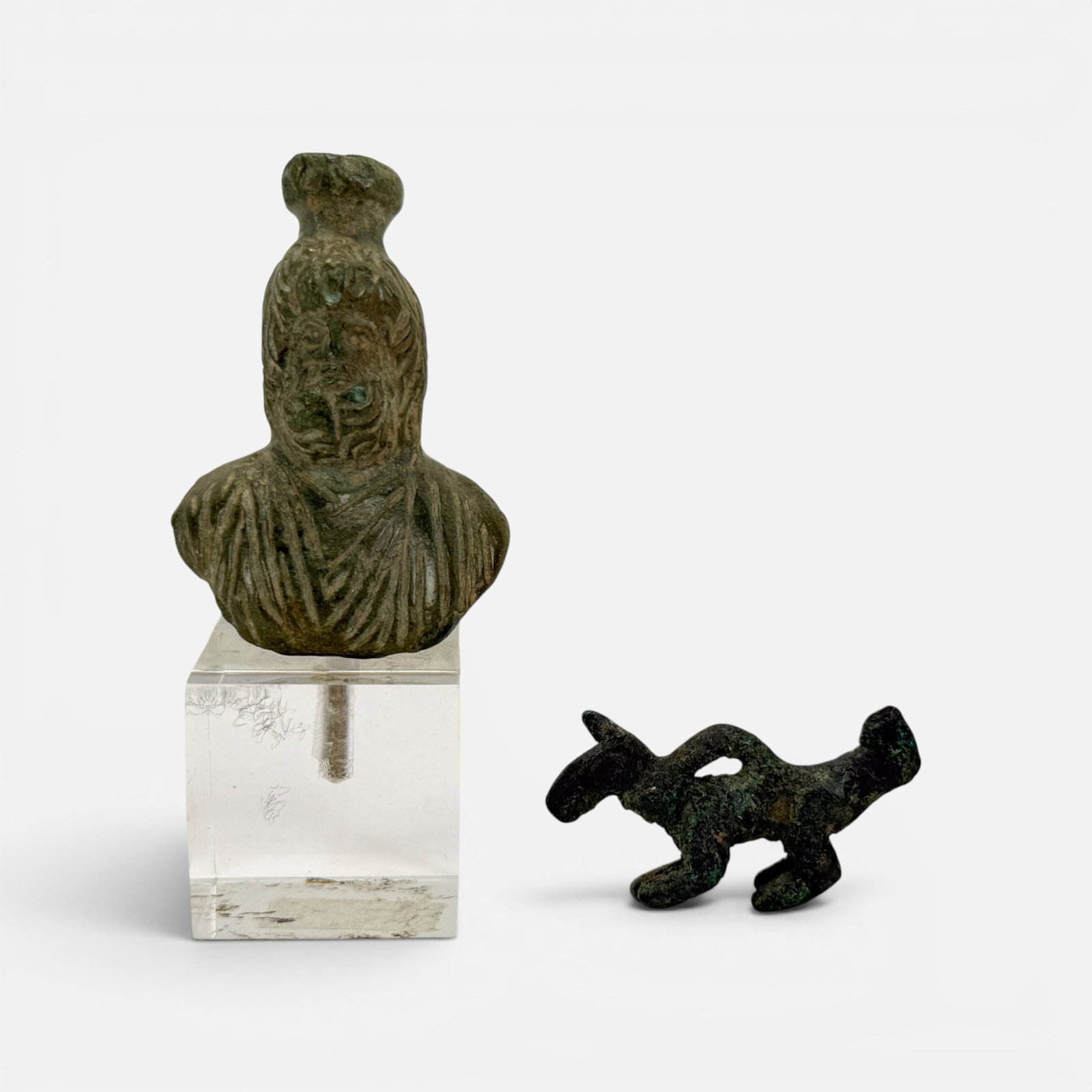 Ancient Roman Bronze Bust of Serapis & Ancient Luristan Bronze Zoomorphic Pendant: Included measurement for bust not including lucite stand. For shipping, we highly recommend Donald Camden at UPS Store 4608. Alternatively, reach out to one of our preferred shippers listed at the lin