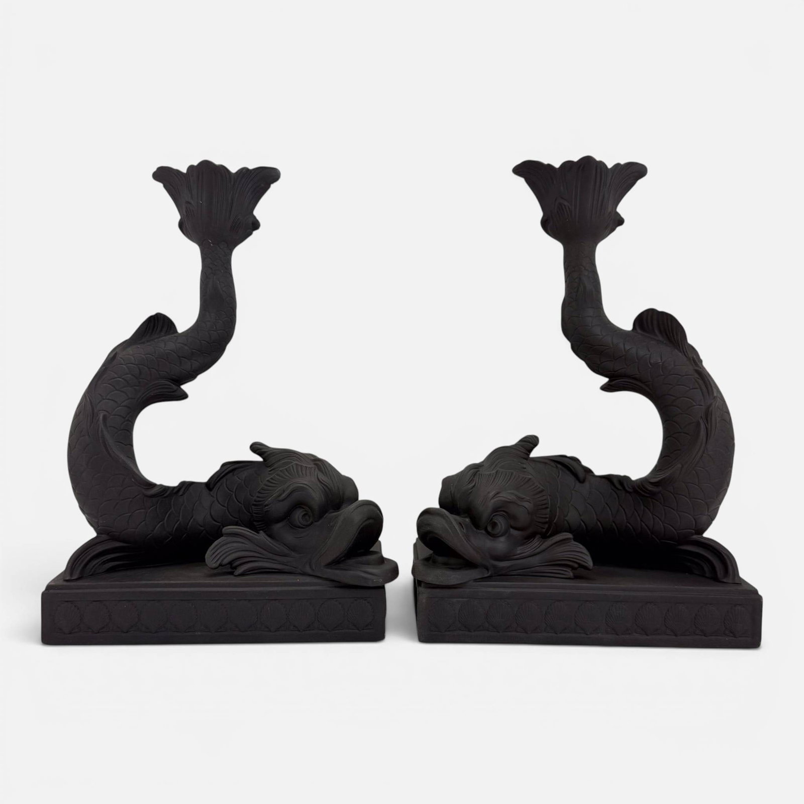 Pair 20thC Wedgwood English Black Basalt Dolphin Bisque Porcelain Candle Holders: Good, with no chips, cracks, or repairs. Measures approx. H: 9", W: 6 1/2". D: 3 3/4". For shipping, we highly recommend Donald Camden at UPS Store 4608. Alternatively, reach out to one of our preferr