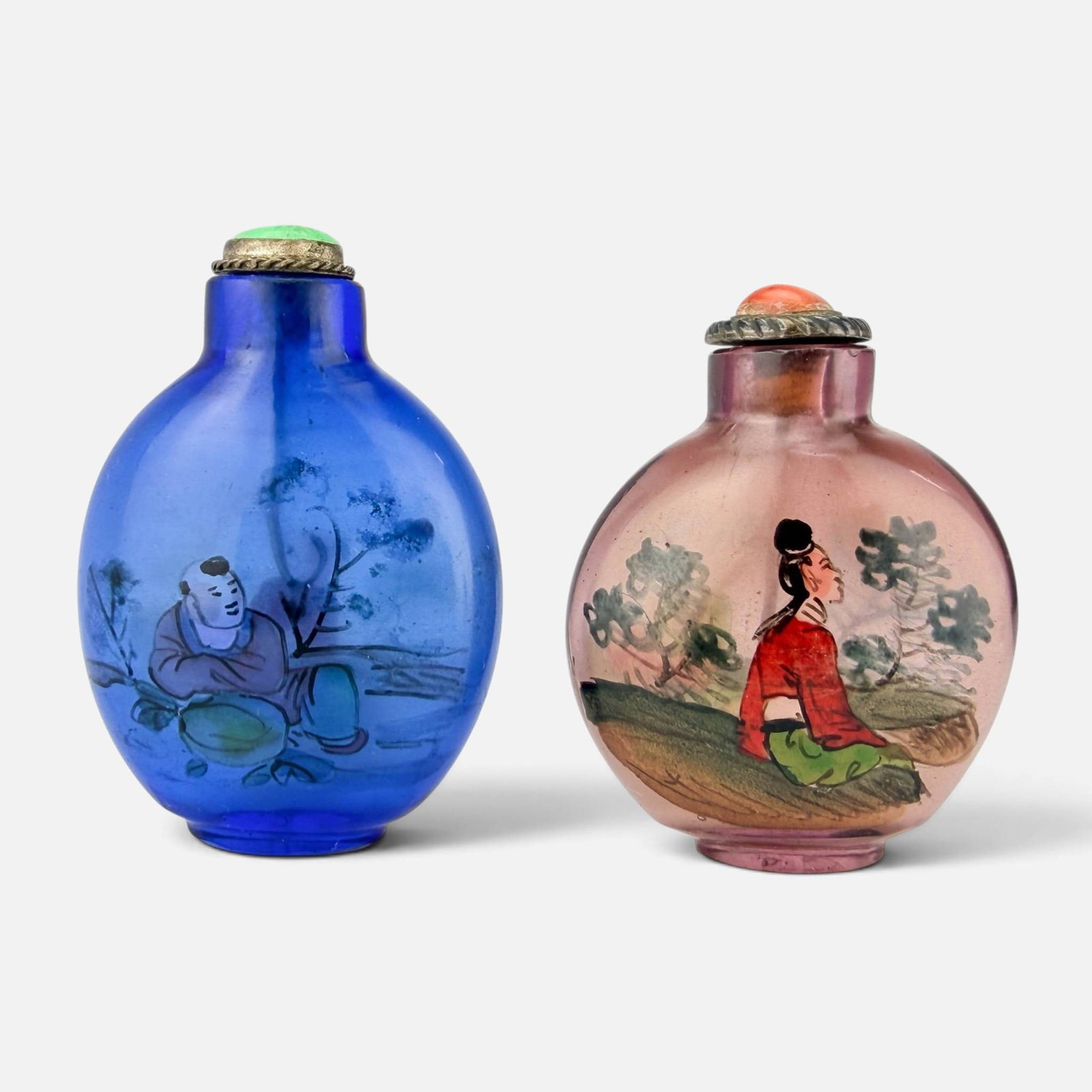 Two Chinese Reverse Painted Glass Snuff Bottles: Very good condition, with no chips, cracks, or repairs. Taller bottle measures approx. H: 2 1/2", W: 1 3/4", D: 3/4". Shorter bottle measures approx. H: 2 3/8", W: 1 3/4", D: 7/8". For shipping, we