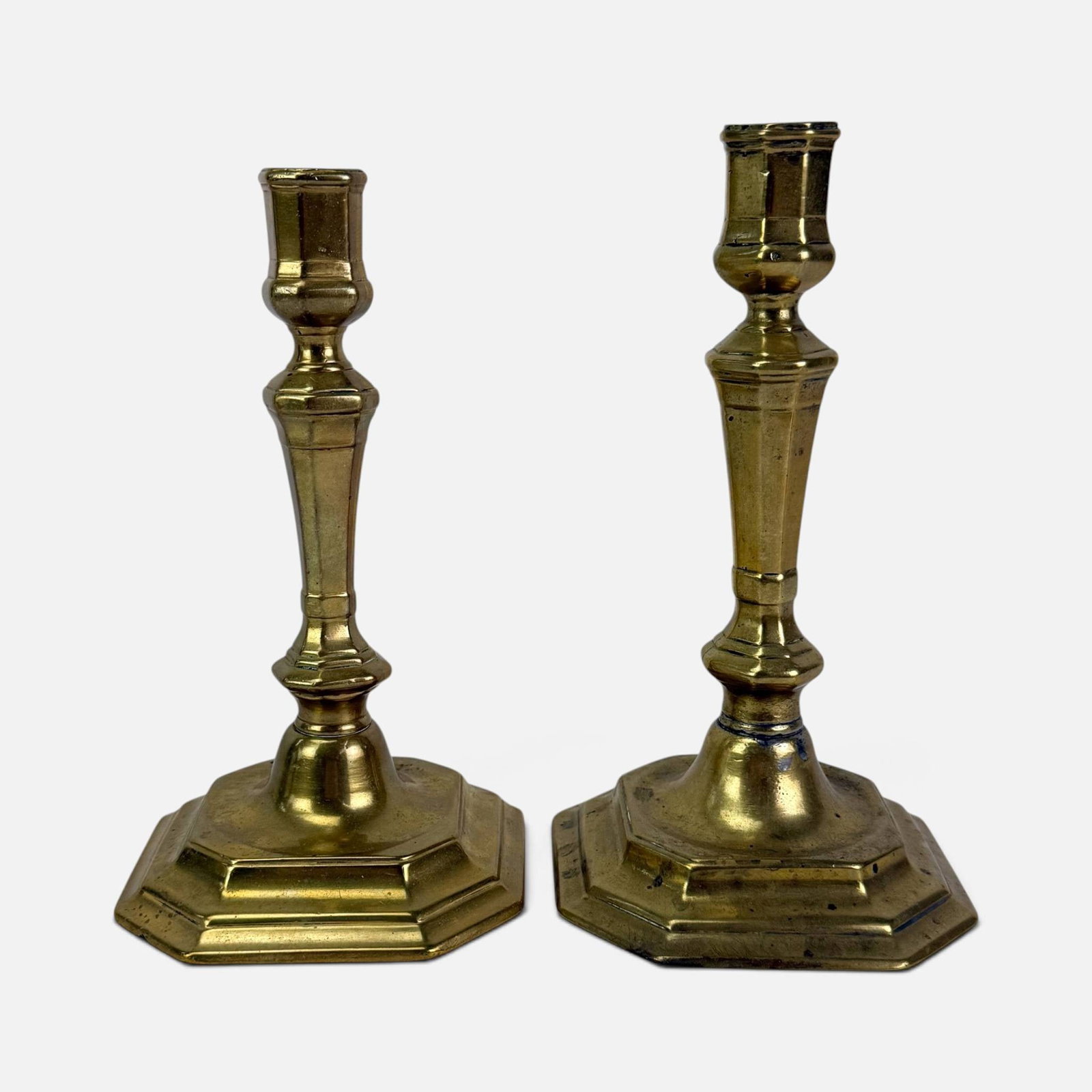 Pair Antique 19thC French Brass Candlesticks: Ca. 19thC. Good, with age-appropriate surface wear and discoloration. Measurement is for the taller one. For shipping, we highly recommend Donald Camden at UPS Store 4608. Alternatively, reach out to