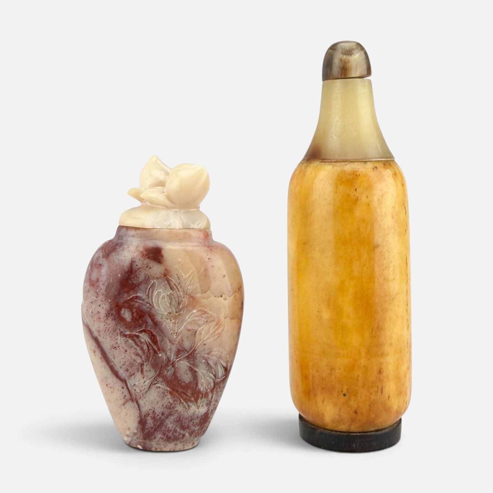 Two Chinese Carved Stone & Bone Snuff Bottles: See breaks to one lid. Otherwise, good. Taller bottle measures approx. H: 3 1/4", W: 1", D: 1", shorter bottle measures approx. 2 3/8" tall. For shipping, we highly recommend Donald Camden at UPS