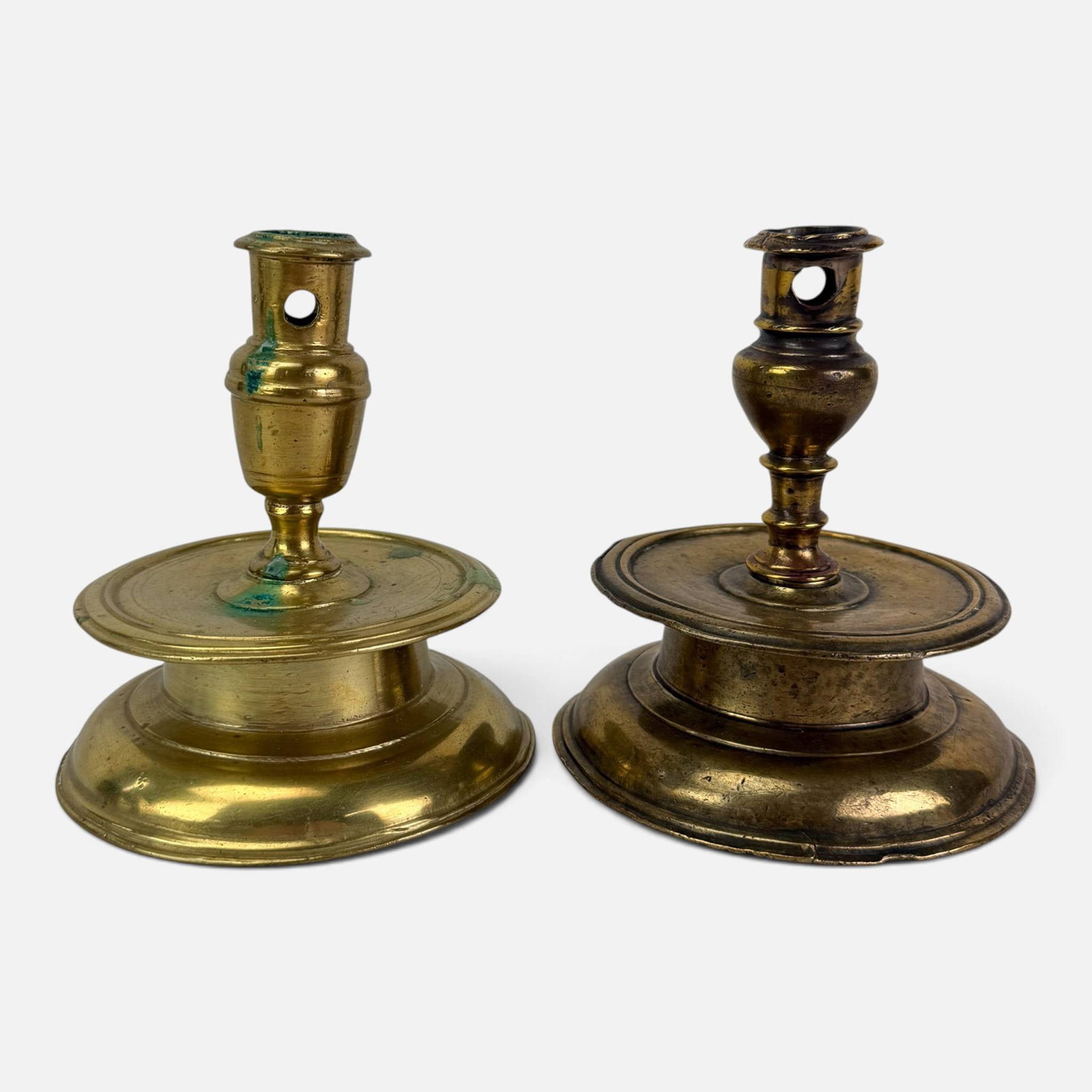 Two Antique 17th/18thC Brass Capstan Candlesticks: Ca. 17th to 18thC. Good with shown bends, surface wear, and discoloration. Ex. Robert Flourance collection, VA. For shipping, we highly recommend Donald Camden at UPS Store 4608. Alternatively, reach