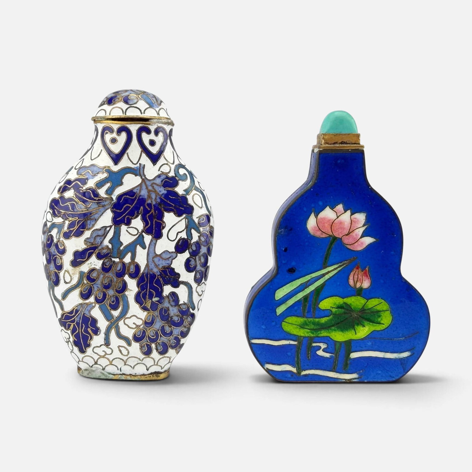 Two Chinese Cloisonne Snuff Bottles: Blue and white snuff measures approx. H: 2 7/8", W: 1 3/4", D: 5/8". For shipping, we highly recommend Donald Camden at UPS Store 4608. Alternatively, reach out to one of our preferred shippers