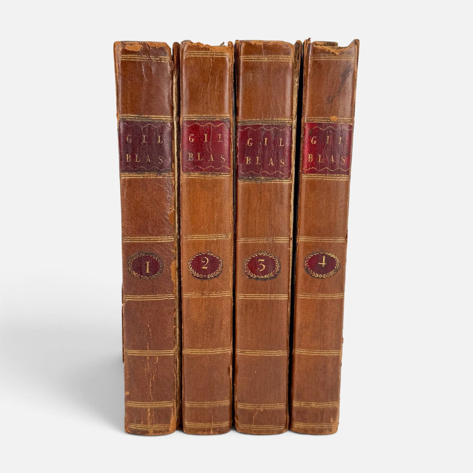 1789 The Adventures of Gil Blas of Santillane Leather Bound Book Set Vol 1-4: See photos for condition. One cover detached. Scattered foxing. Appears complete. Attractive antique set, tenth edition. For shipping, we highly recommend Donald Camden at UPS Store 4608.