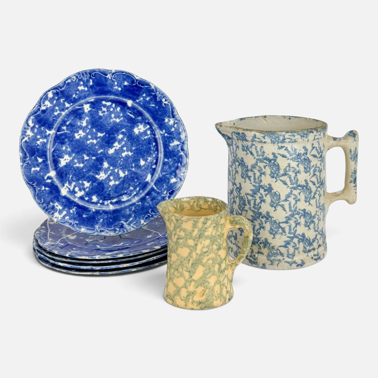 Antique 19thC Spongeware Stoneware Plates and Pitchers 7pcs: Ca. late 19thC. Very good age-appropriate condition, with no chips, cracks, or repairs. Dishes measure approx. 8 1/2" wide. Larger pitcher measures approx. H: 6 3/4", W: 7", D: 5". For shipping, we hi