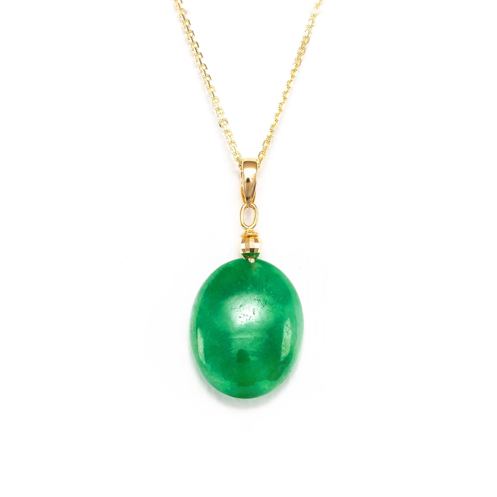 18k Yellow Gold - 5.08tcw - Jadeite Pendant: No Reserve Price! Grading Results: ___________ Stone Type: Natural Jadeite Shape: Oval Cabochon Carat: 5.08 ct Color: Green Clarity: NONE Jewelry Material: 18k Yellow Gold To