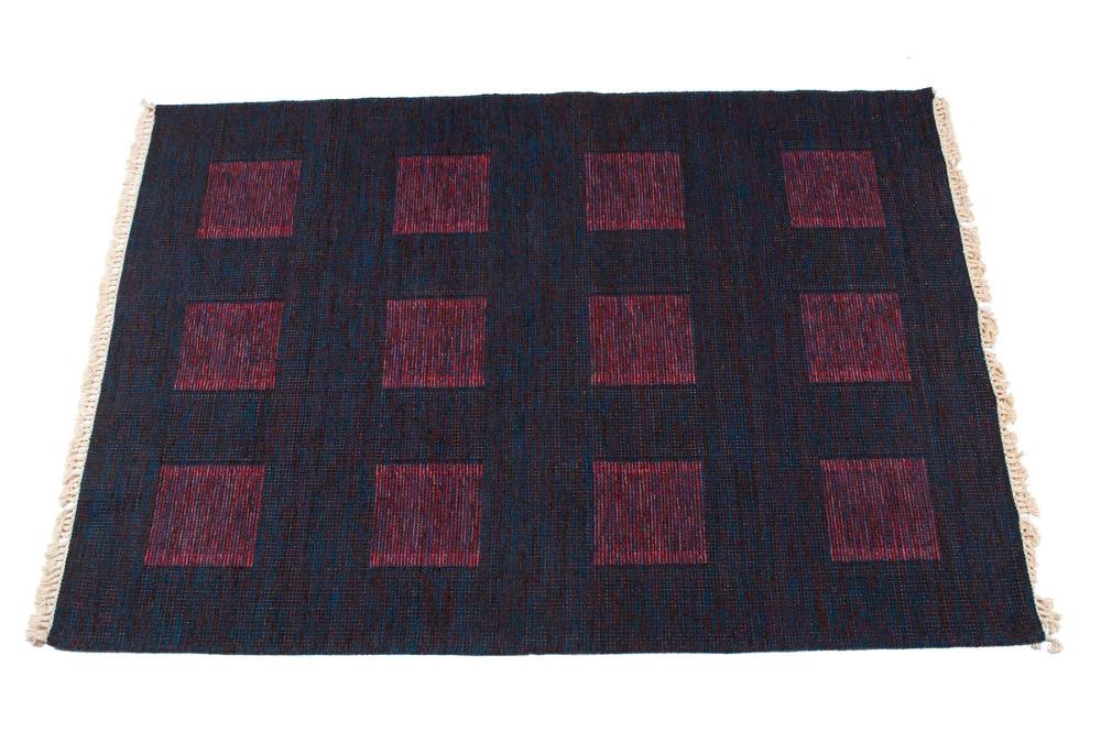 HALL RUG: HALL RUG New, wool. Woven in dark shades of blue and brown with multi-colored squares toward lavender. 8' length, 5' 7" width Notes By Concepts International.